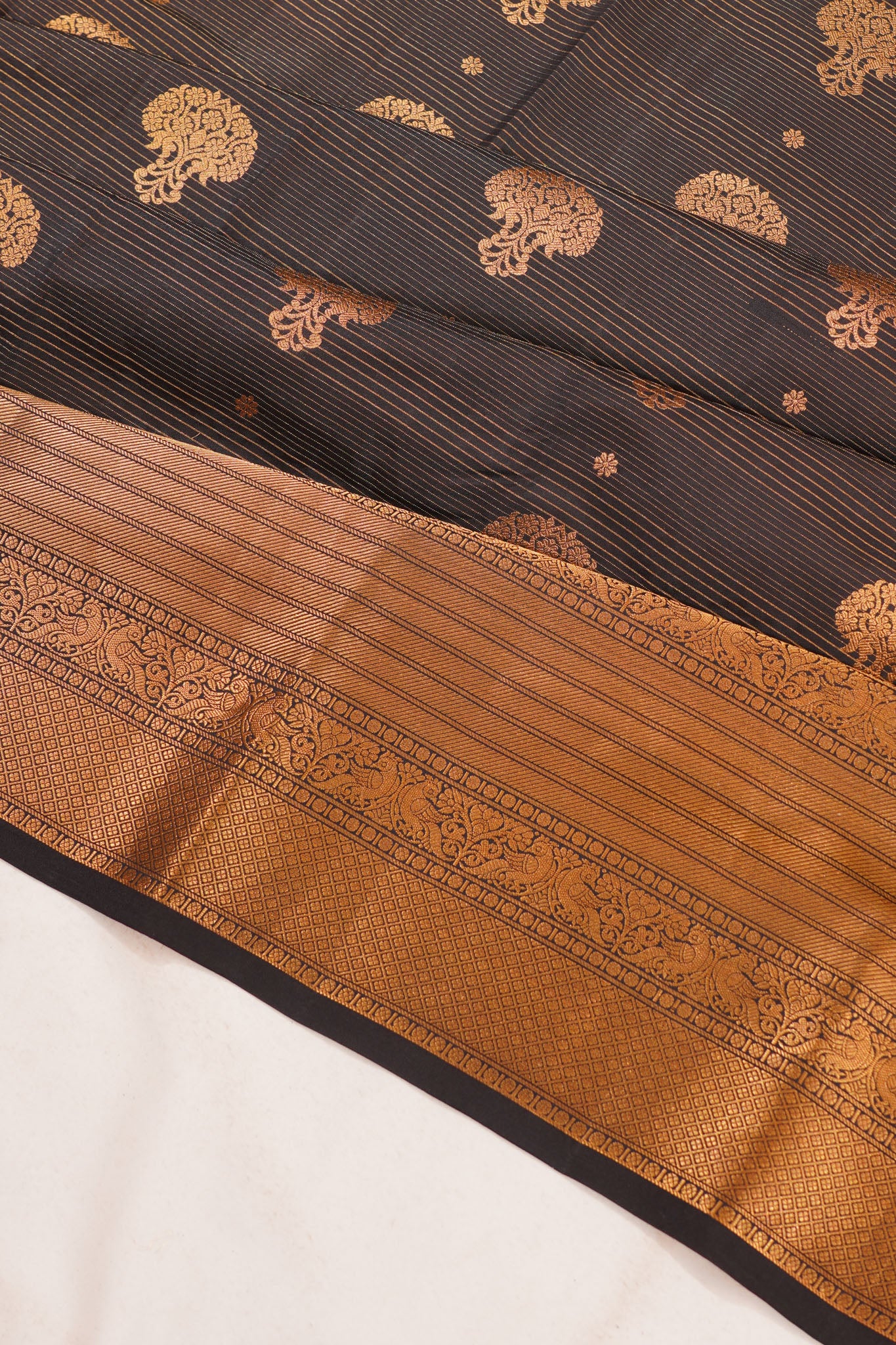 Taranga Kanchi Silk Oosi Lines And Butta Black Saree