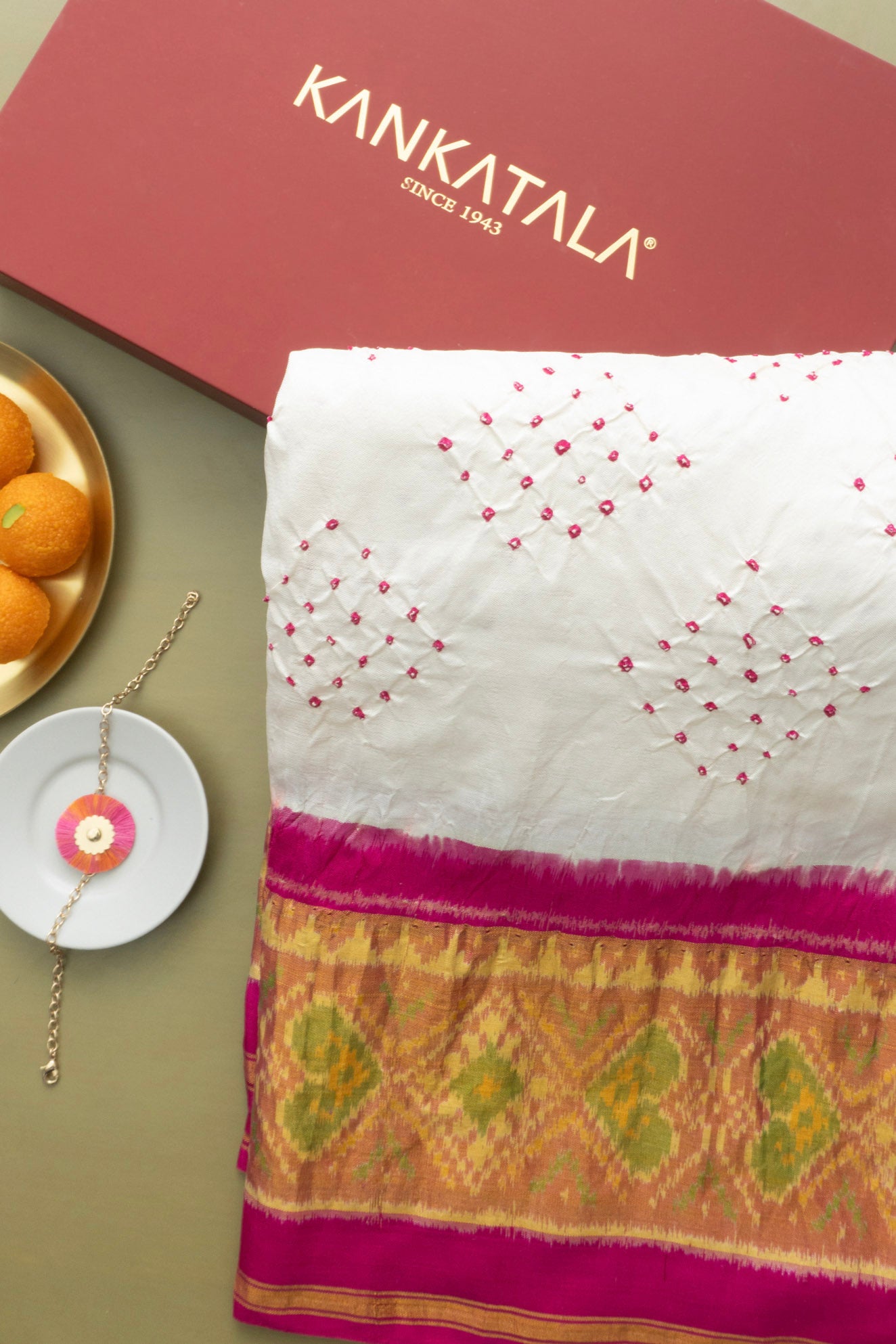Rajkot Patola Silk Ikat Bandhani White Saree With Rakhi