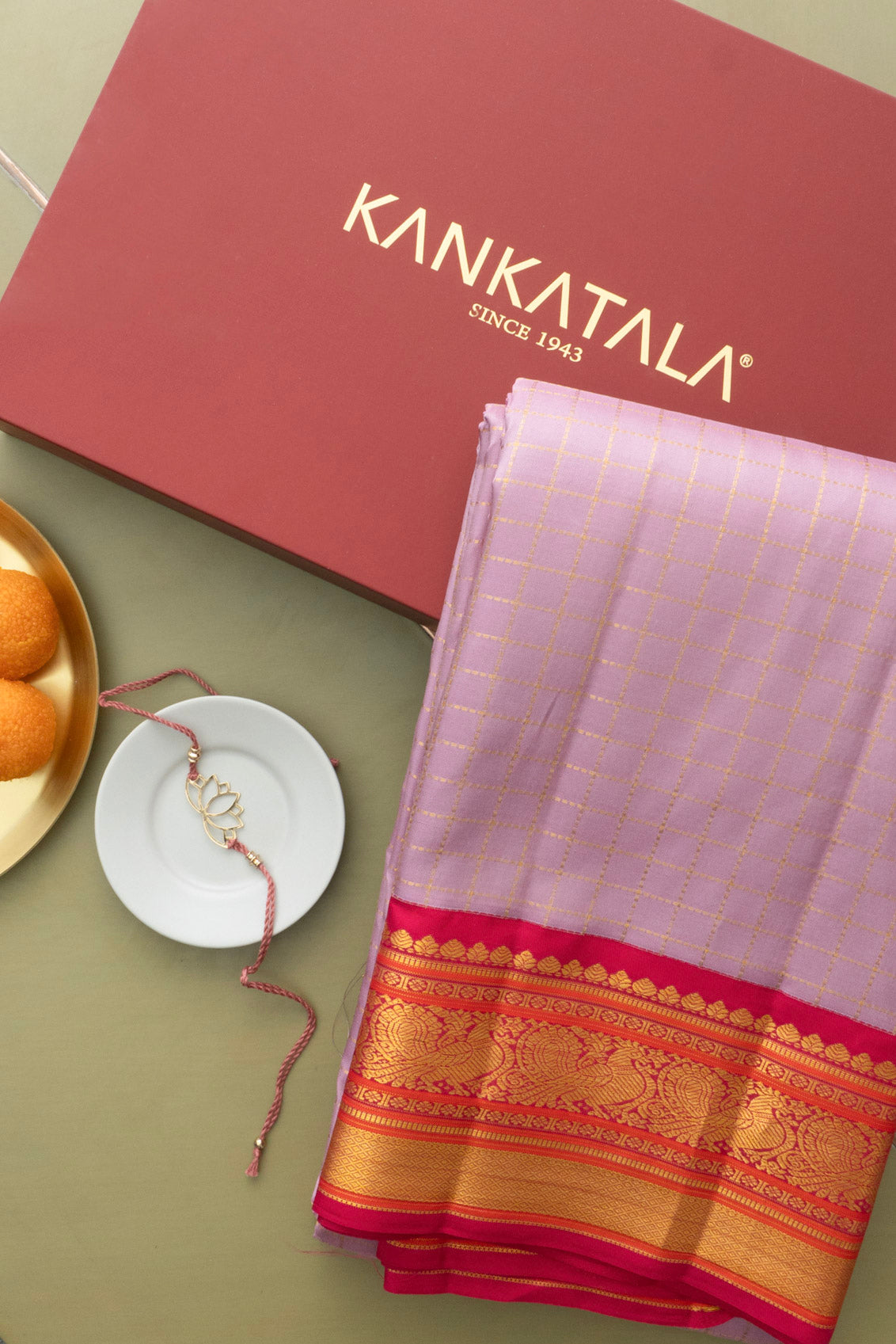 Kanchipuram Silk Checks Lavender Saree With Rakhi