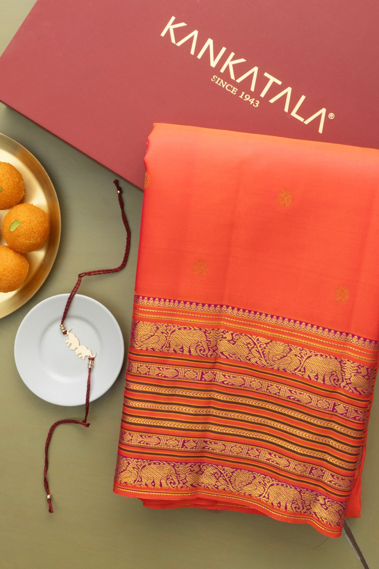 Classic Kanchipuram Silk Butta Orange Saree With Rakhi