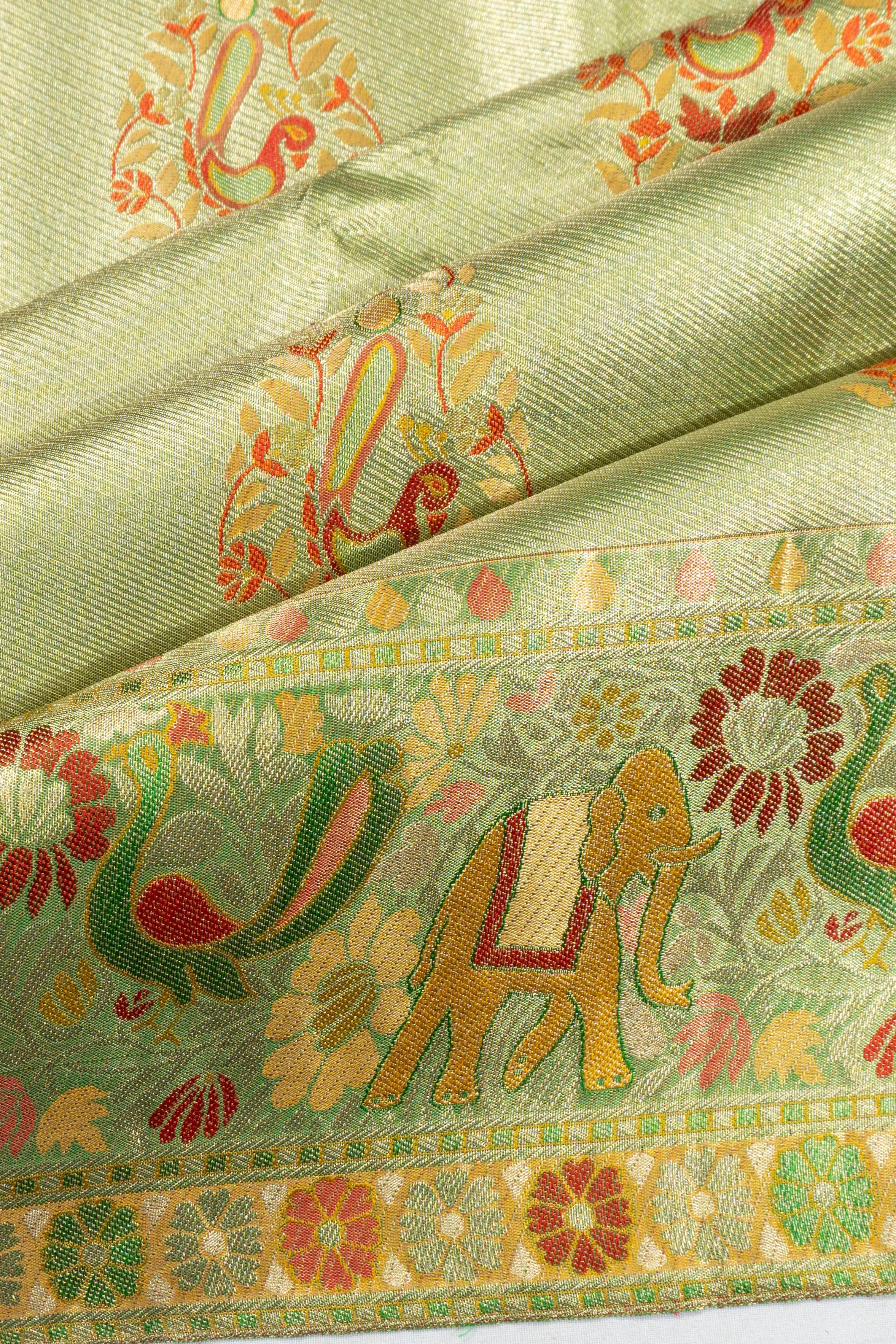 Taranga Kanchi Silk Tissue Butta Pastel Green Saree