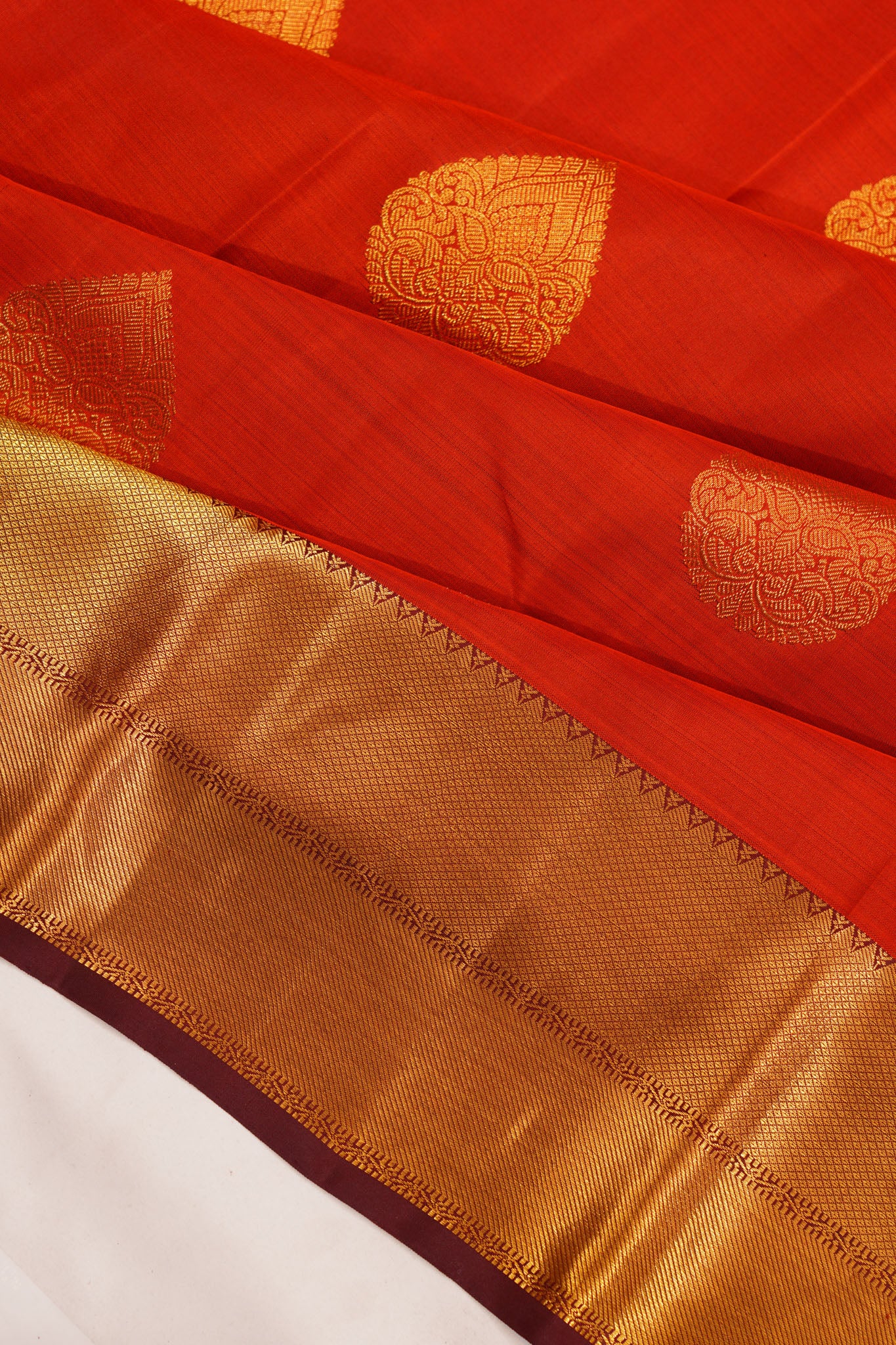 Taranga Kanchi Silk Butta Rust Orange Saree