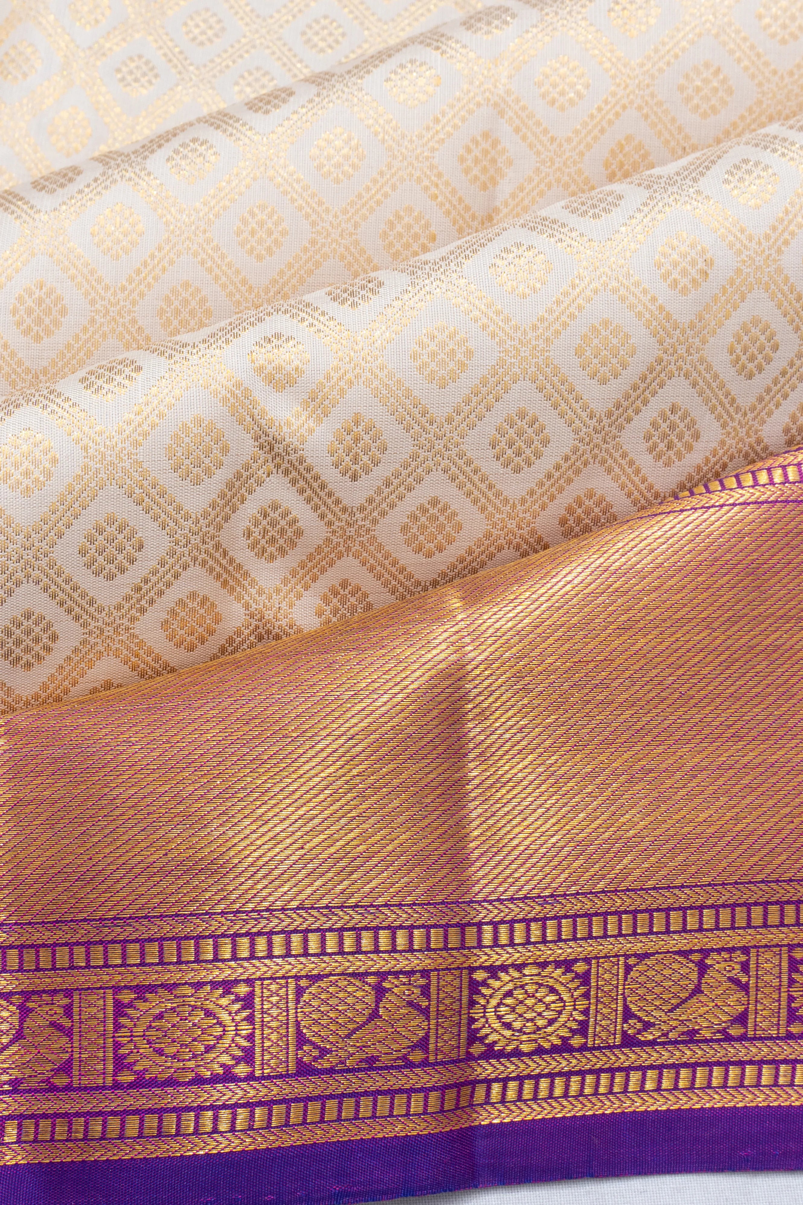 Kanchipuram Silk Criss Cross Checks And Butta Off White Saree