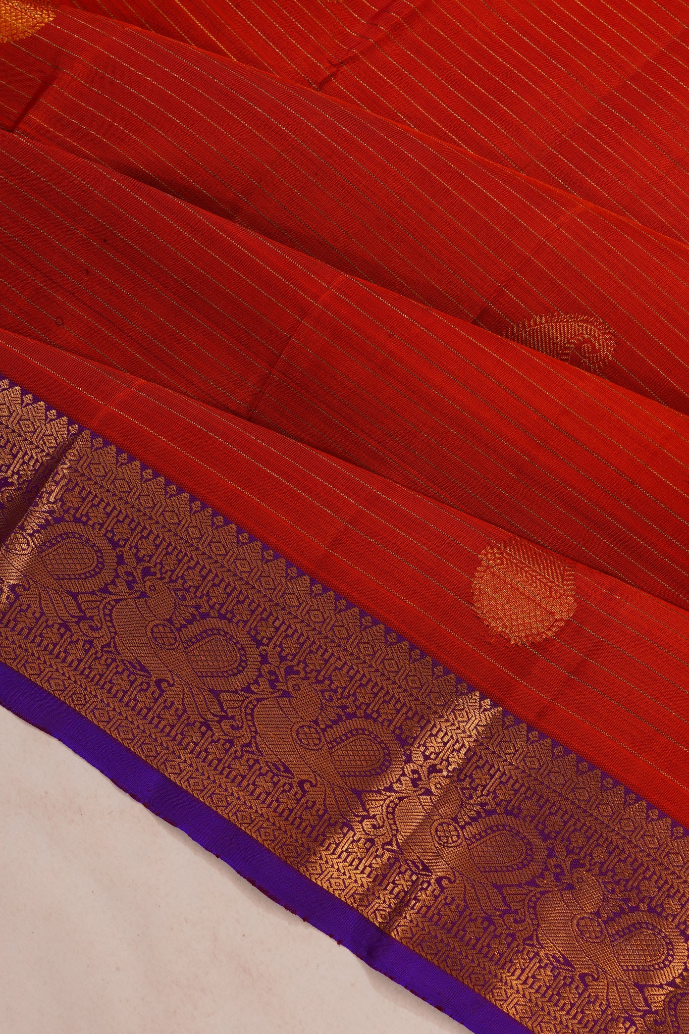 Taranga Kanchi Silk Oosi Lines And Butta Rust Orange Saree