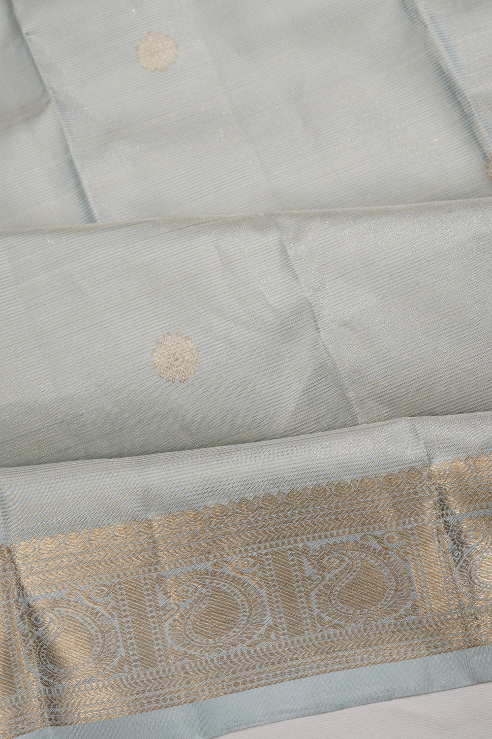 Taranga Kanchi Silk Oosi Lines And Butta Pastel Grey Saree