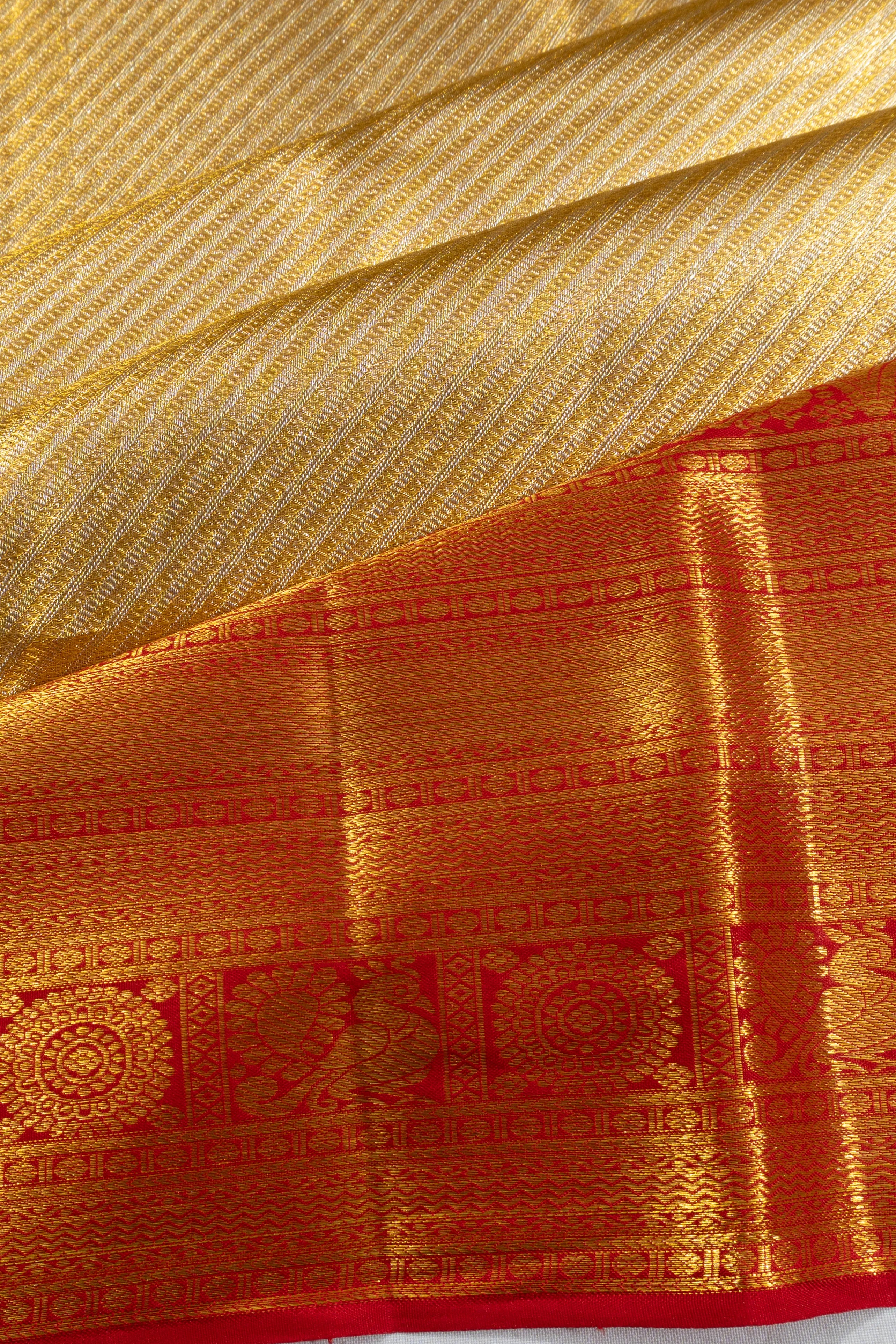 Taranga Kanchi Silk Tissue Diagonal Lines Gold Saree