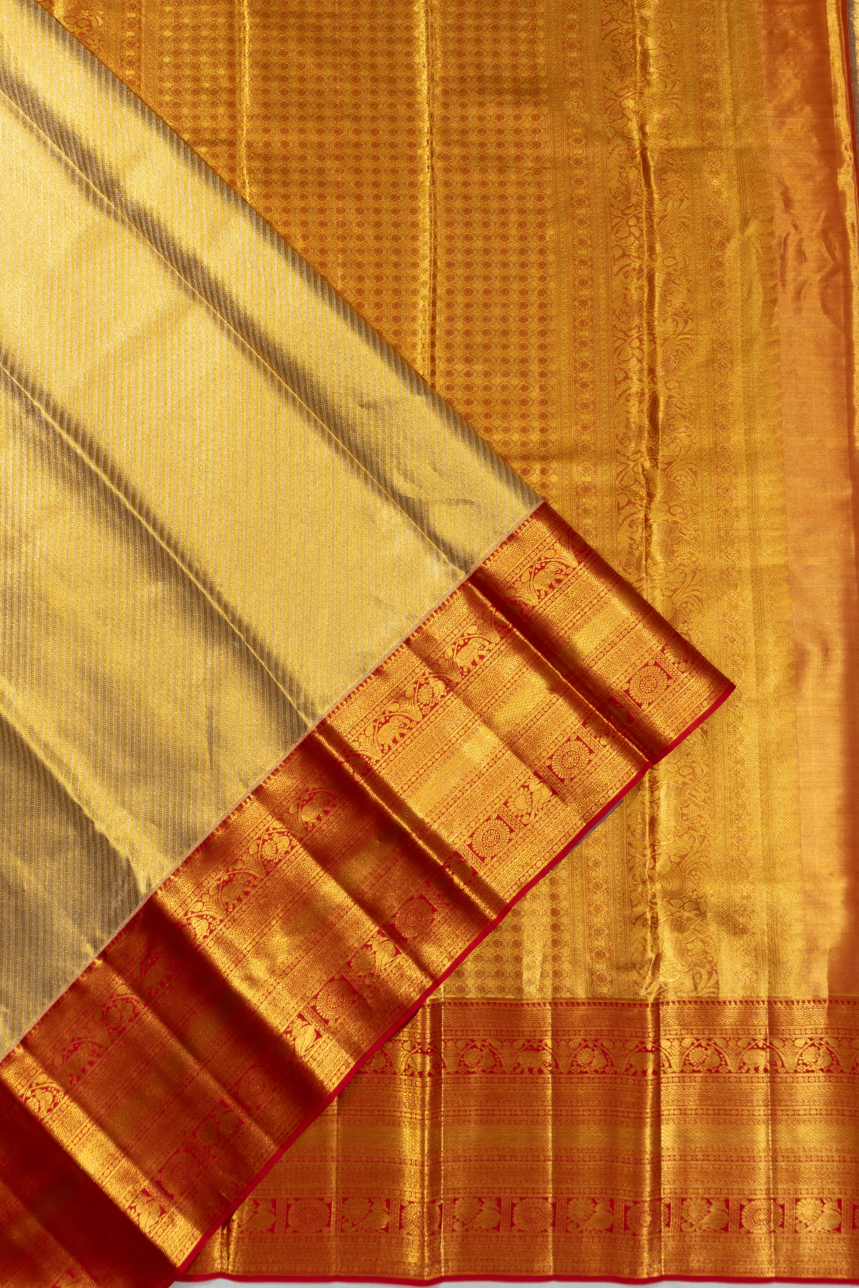 Taranga Kanchi Silk Tissue Diagonal Lines Gold Saree