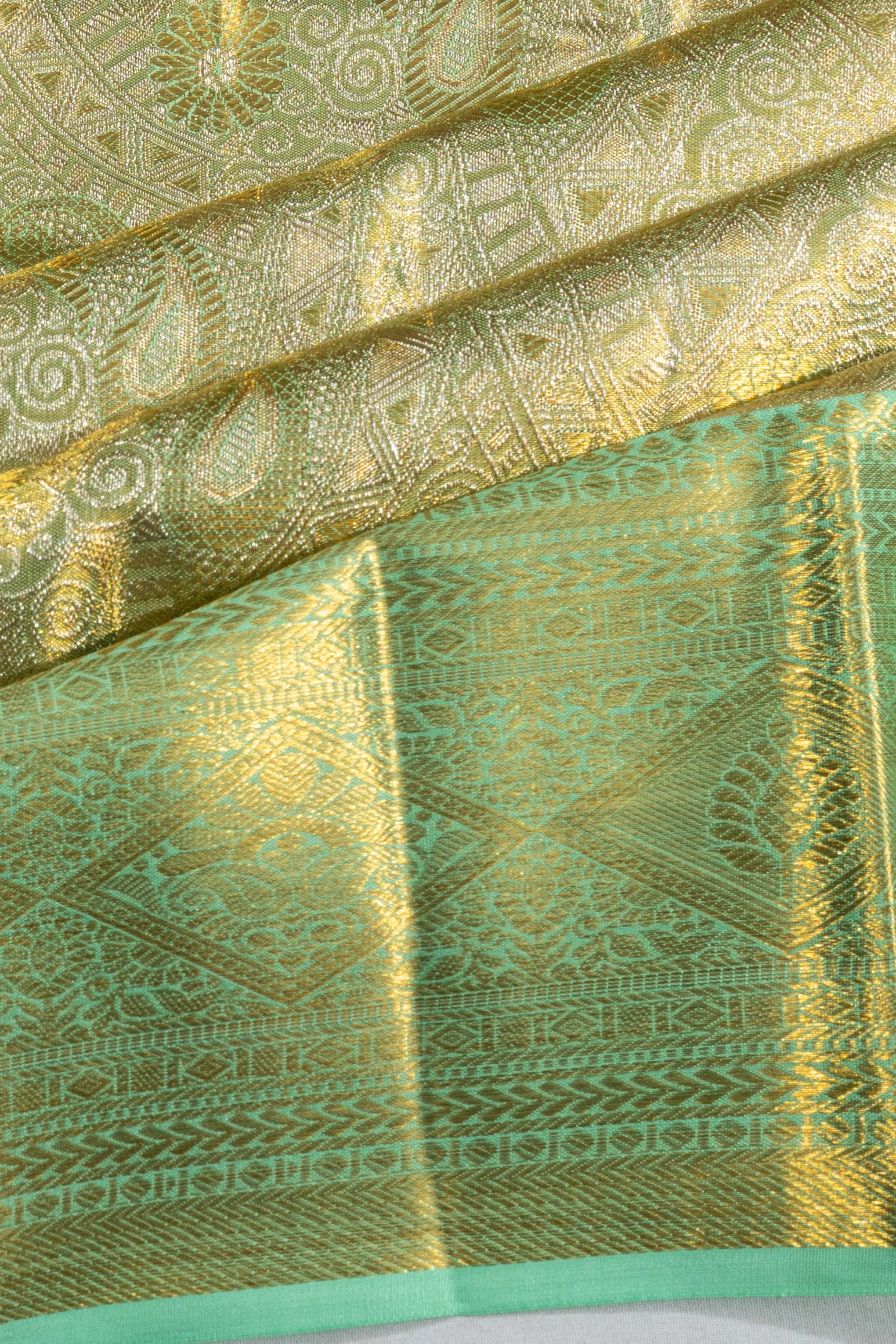 Taranga Kanchi Silk Tissue Brocade Green Saree