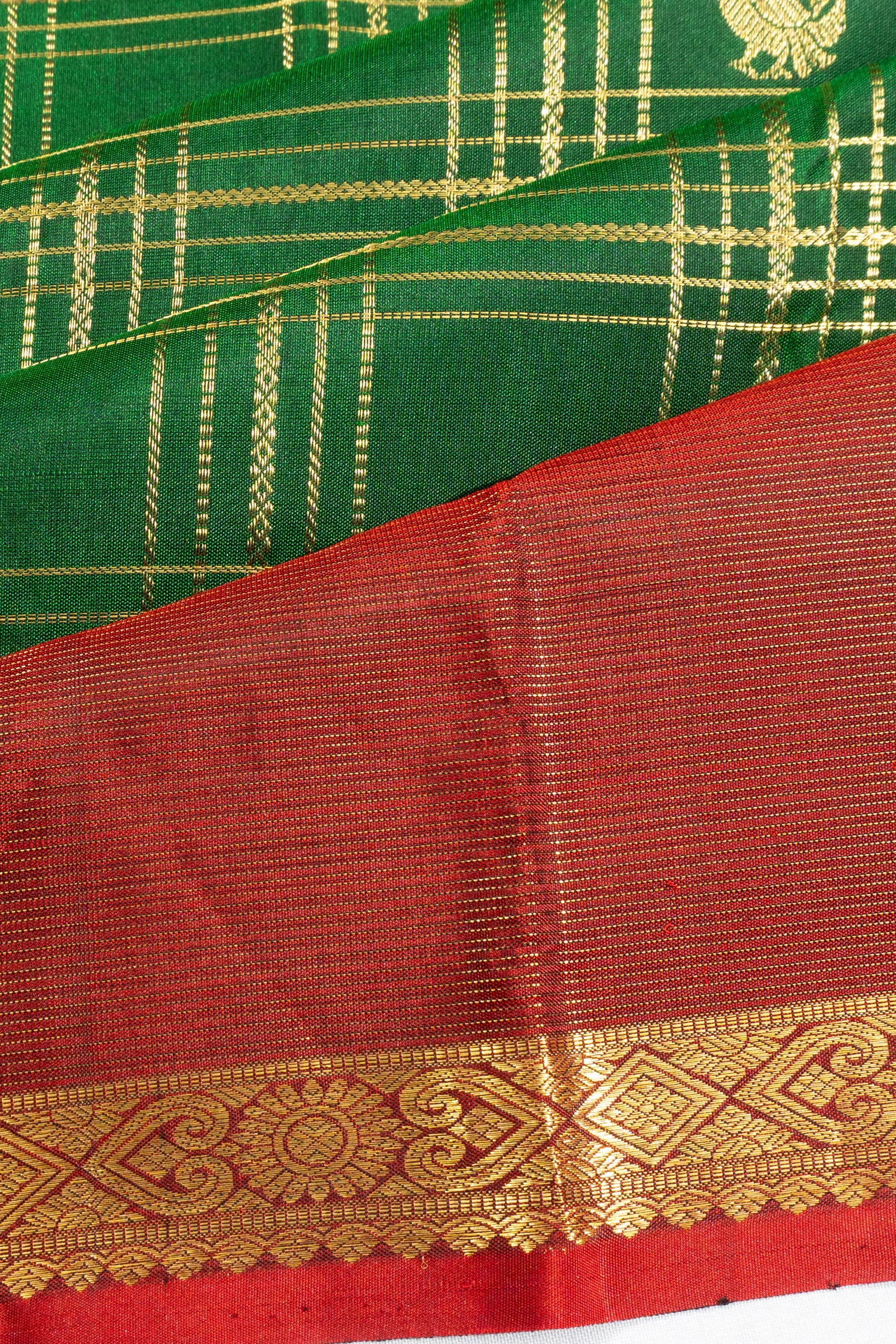 Taranga Kanchi Silk Checks And Butta Green Saree With Rettai Pettu Border