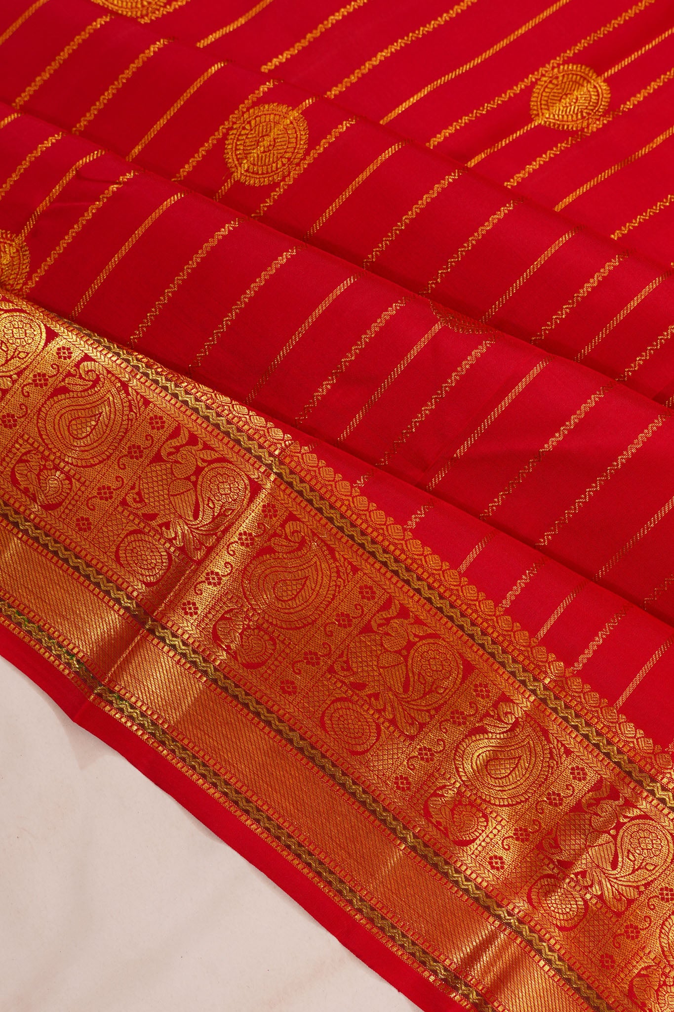 Taranga Kanchi Silk Vertical Iines And Butta Red Saree