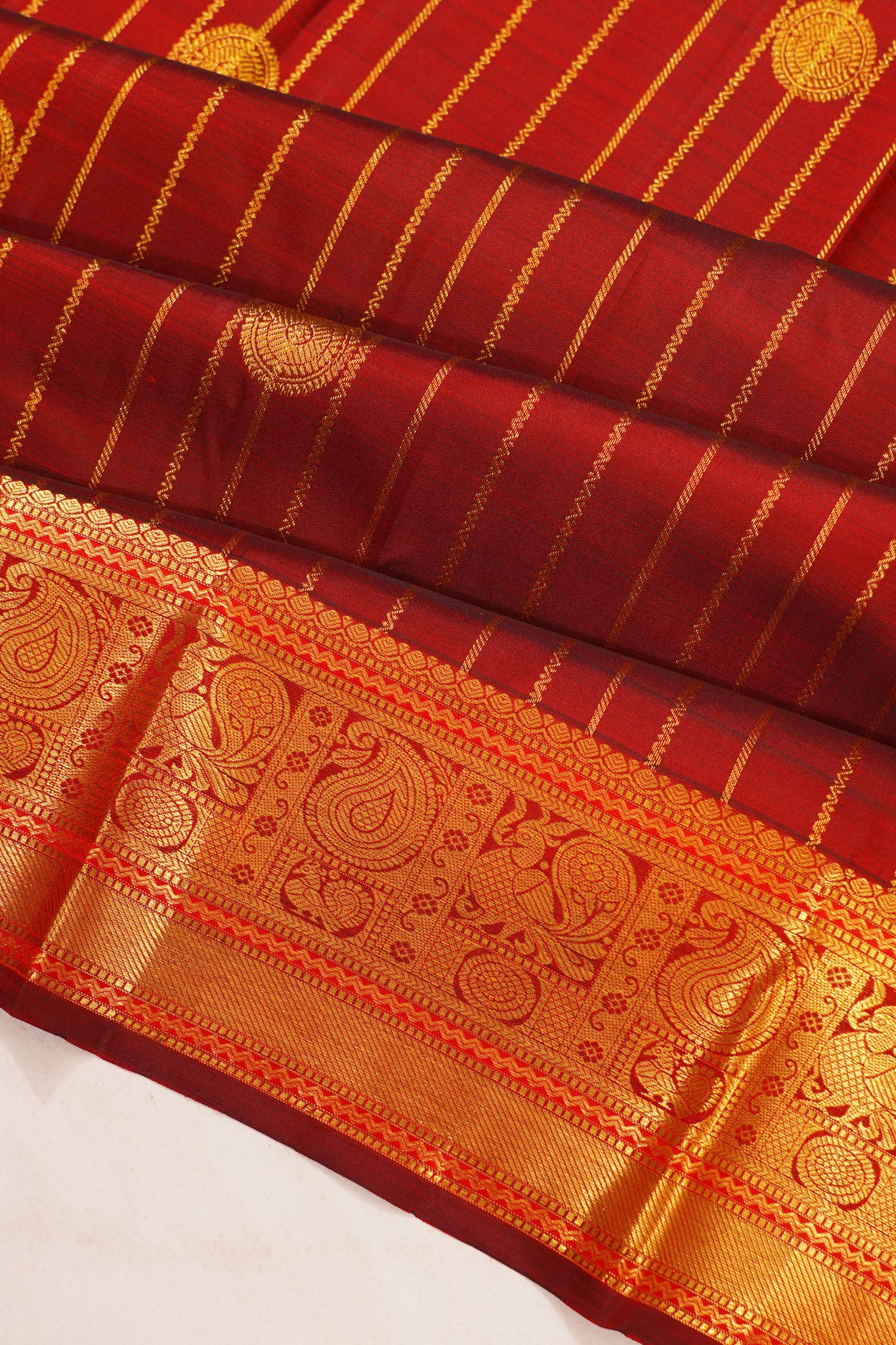 Taranga Kanchi Silk Vertical Iines And Butta Red Saree