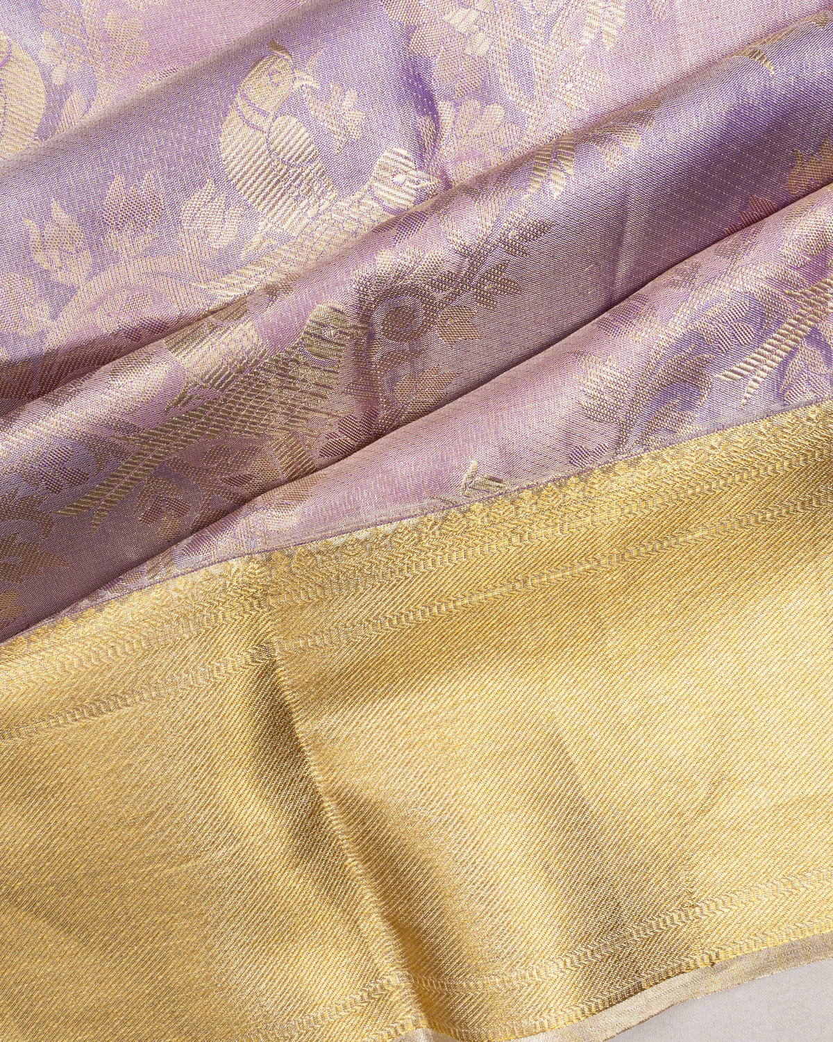 Taranga Kanchi Silk Tissue Brocade And Butta Lavender Saree