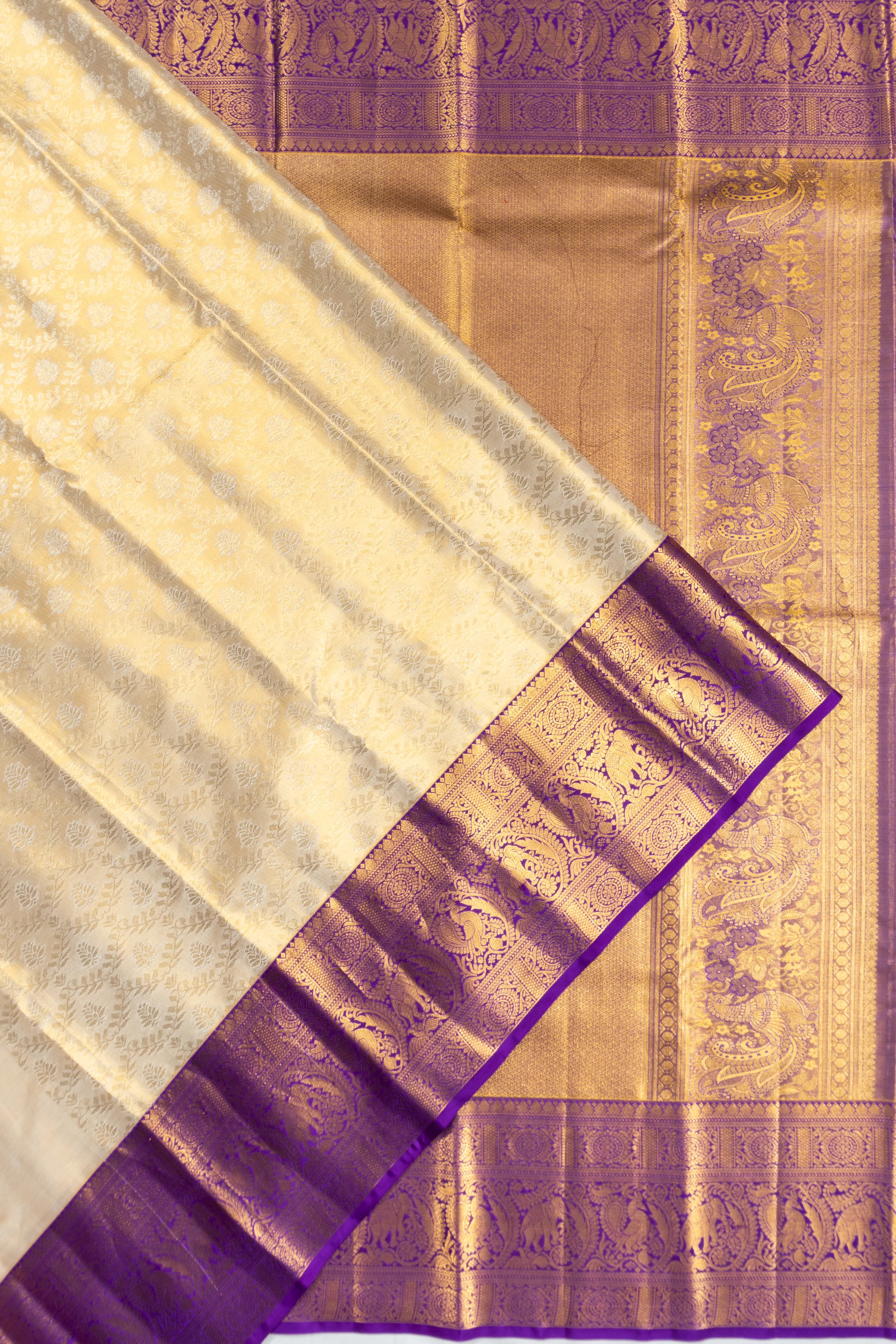Taranga Kanchi Silk Tissue Brocade White Saree