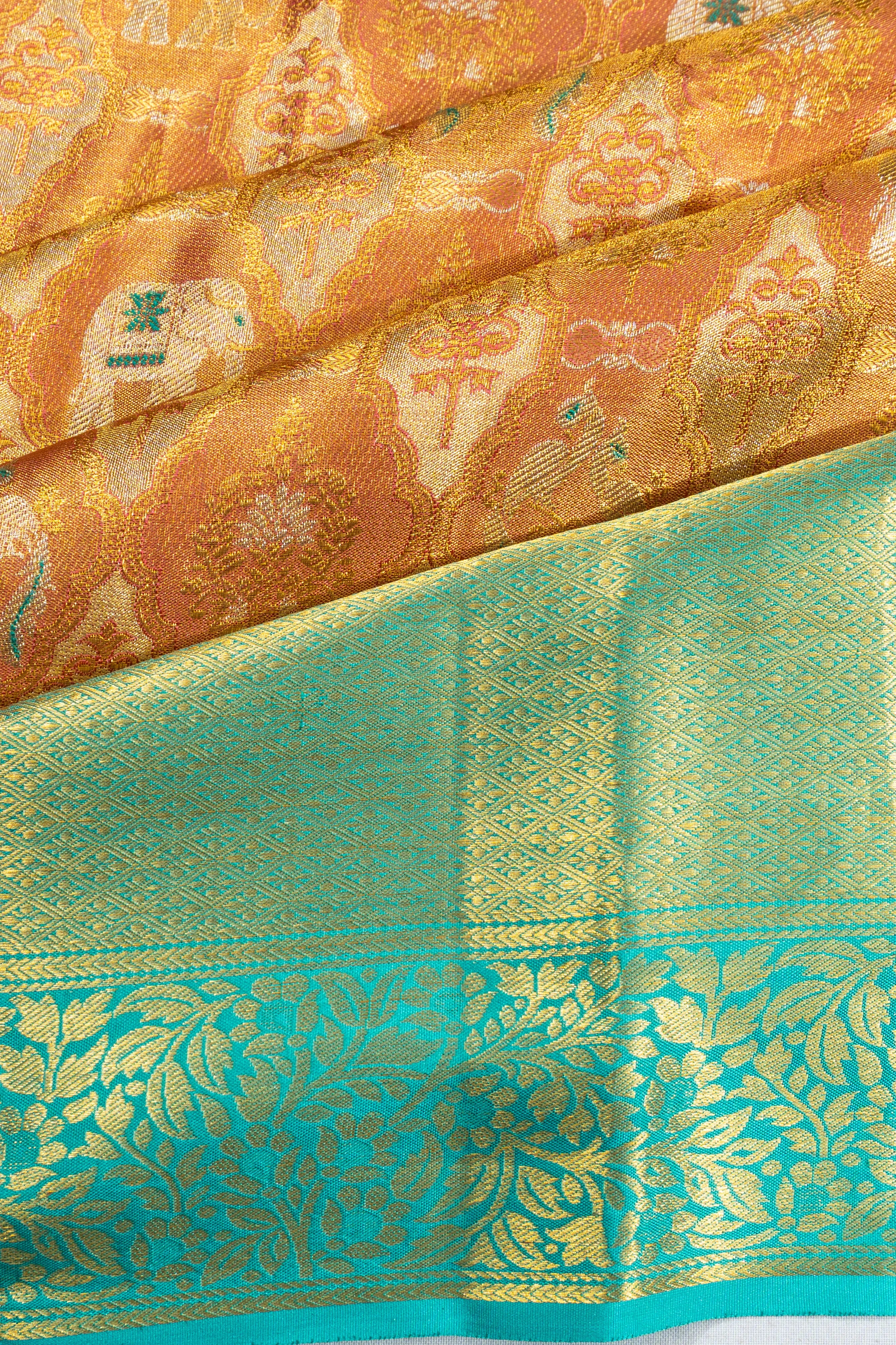 Taranga Kanchi Silk Tissue Brocade Orange Saree