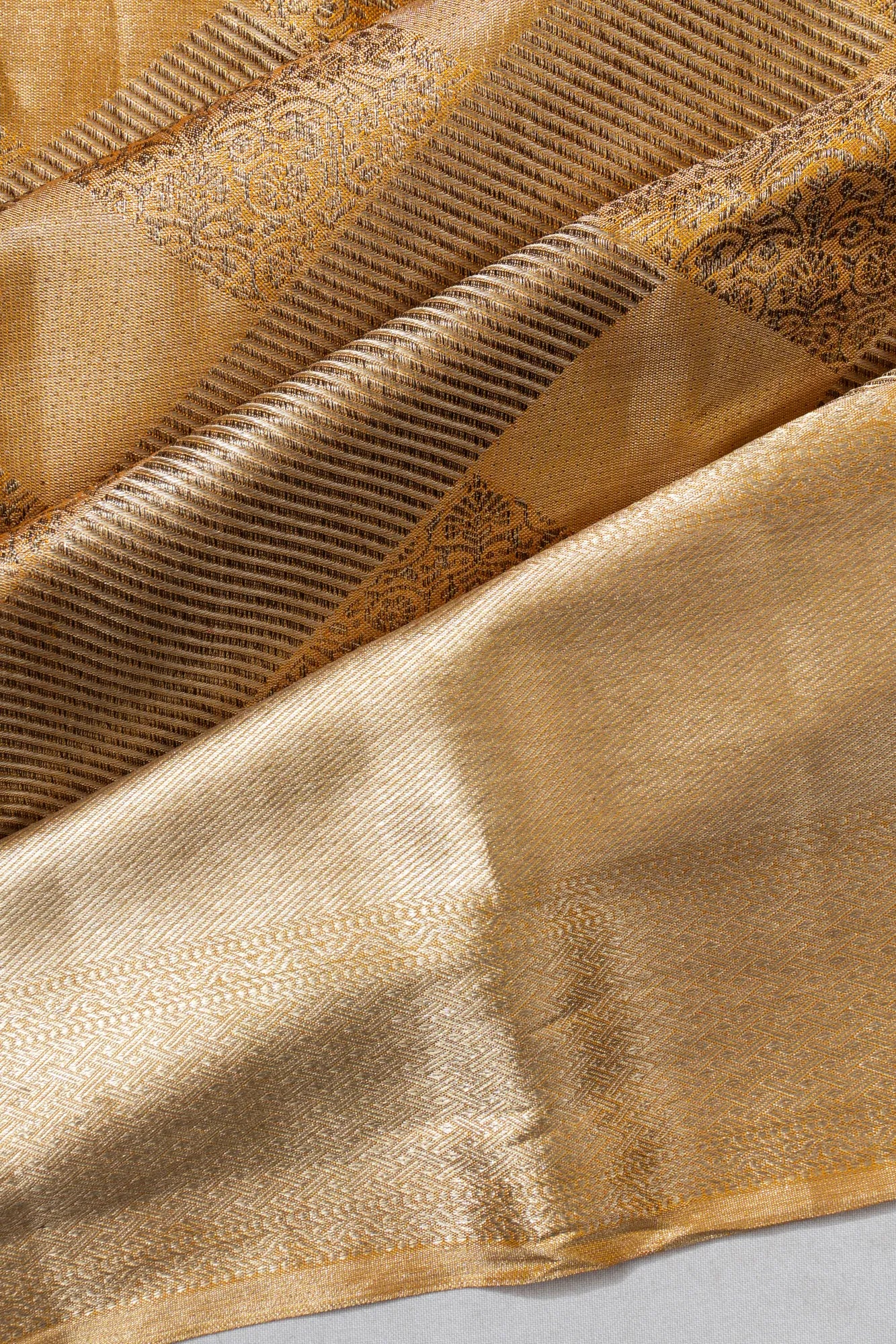 Taranga Kanchi Silk Tissue Geometrical Brocade Gold Saree