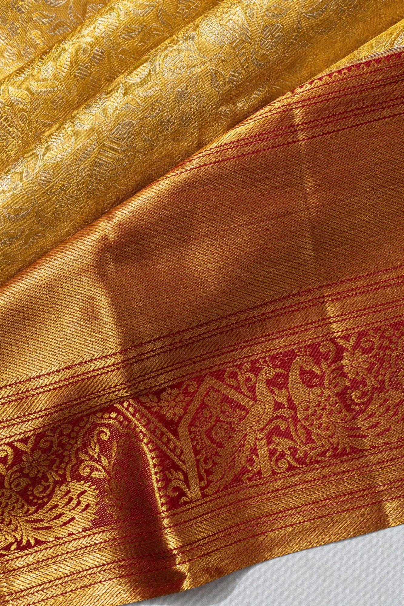 Taranga Kanchi Silk Tissue Brocade Gold Saree