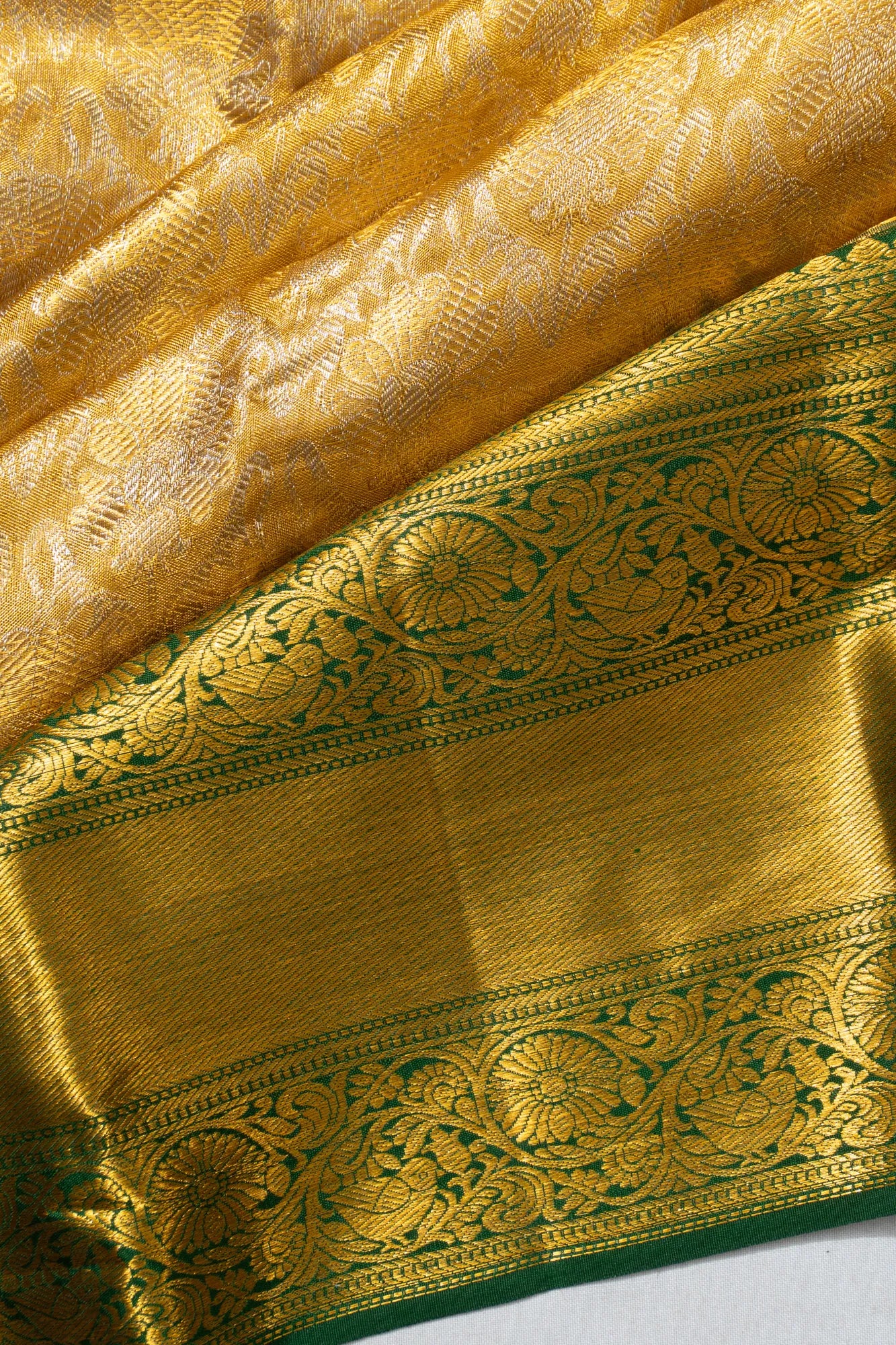 Taranga Kanchi Silk Tissue Brocade Gold Saree