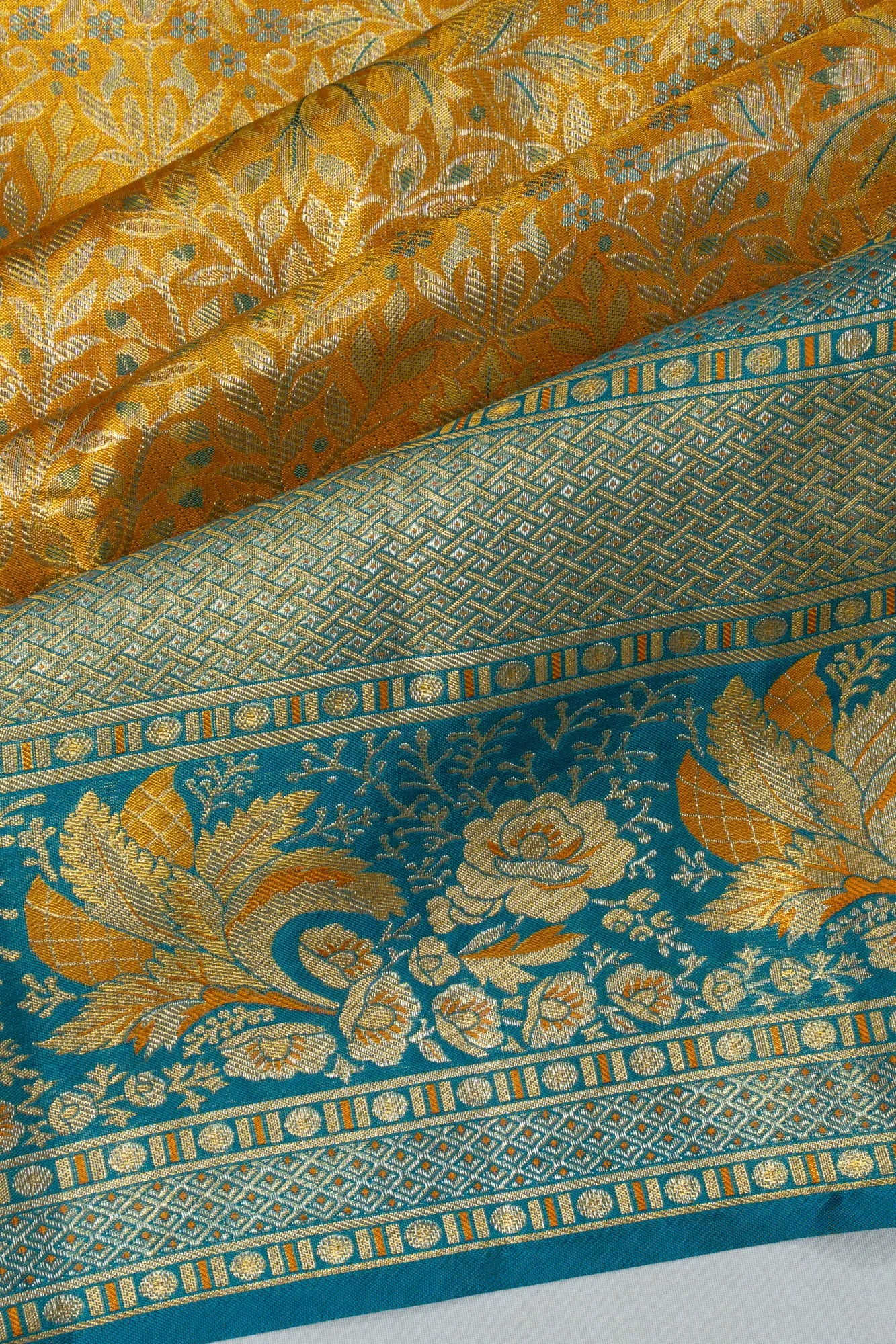 Taranga Kanchi Silk Tissue Brocade Gold Saree