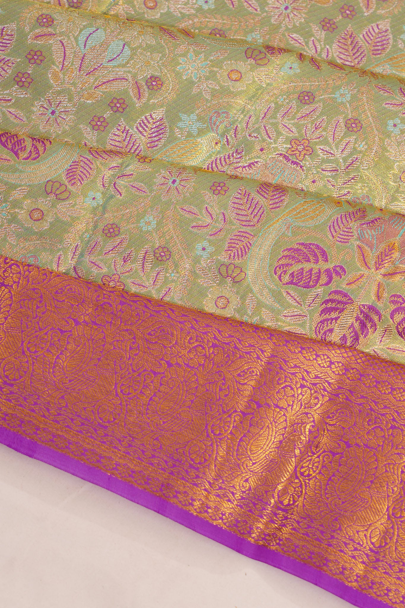 Taranga Kanchi Silk Tissue Brocade Green Saree