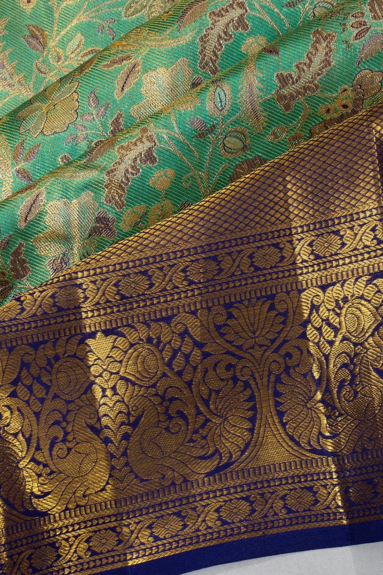 Taranga Kanchi Silk Tissue Brocade Green Saree