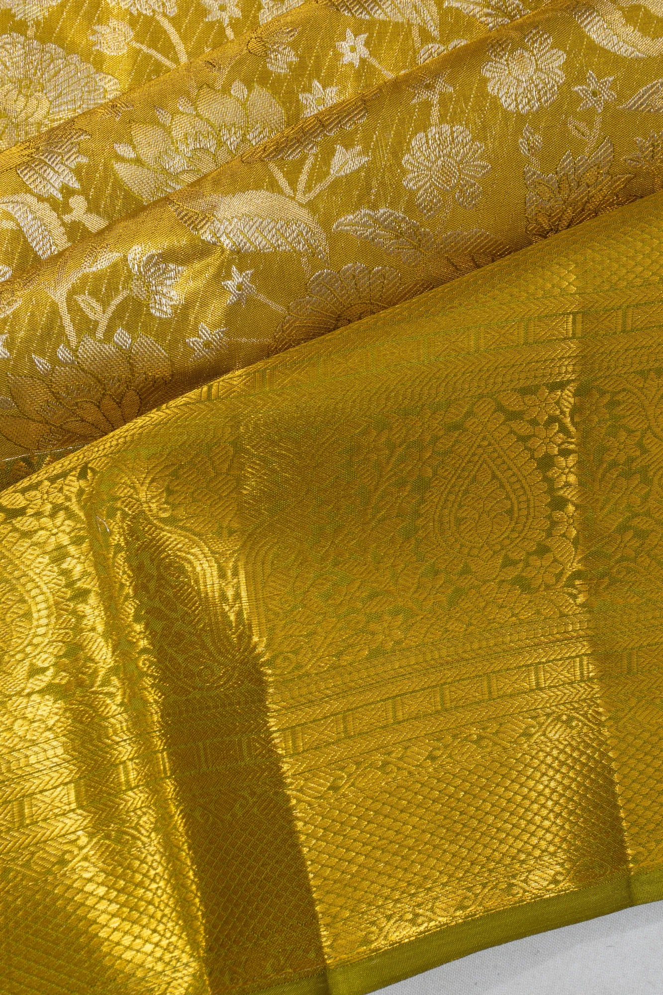 Taranga Kanchi Silk Tissue Brocade Green Saree