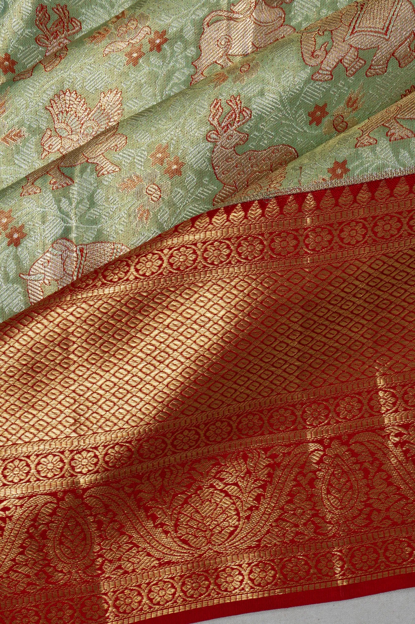 Taranga Kanchi Silk Tissue Brocade Green Saree