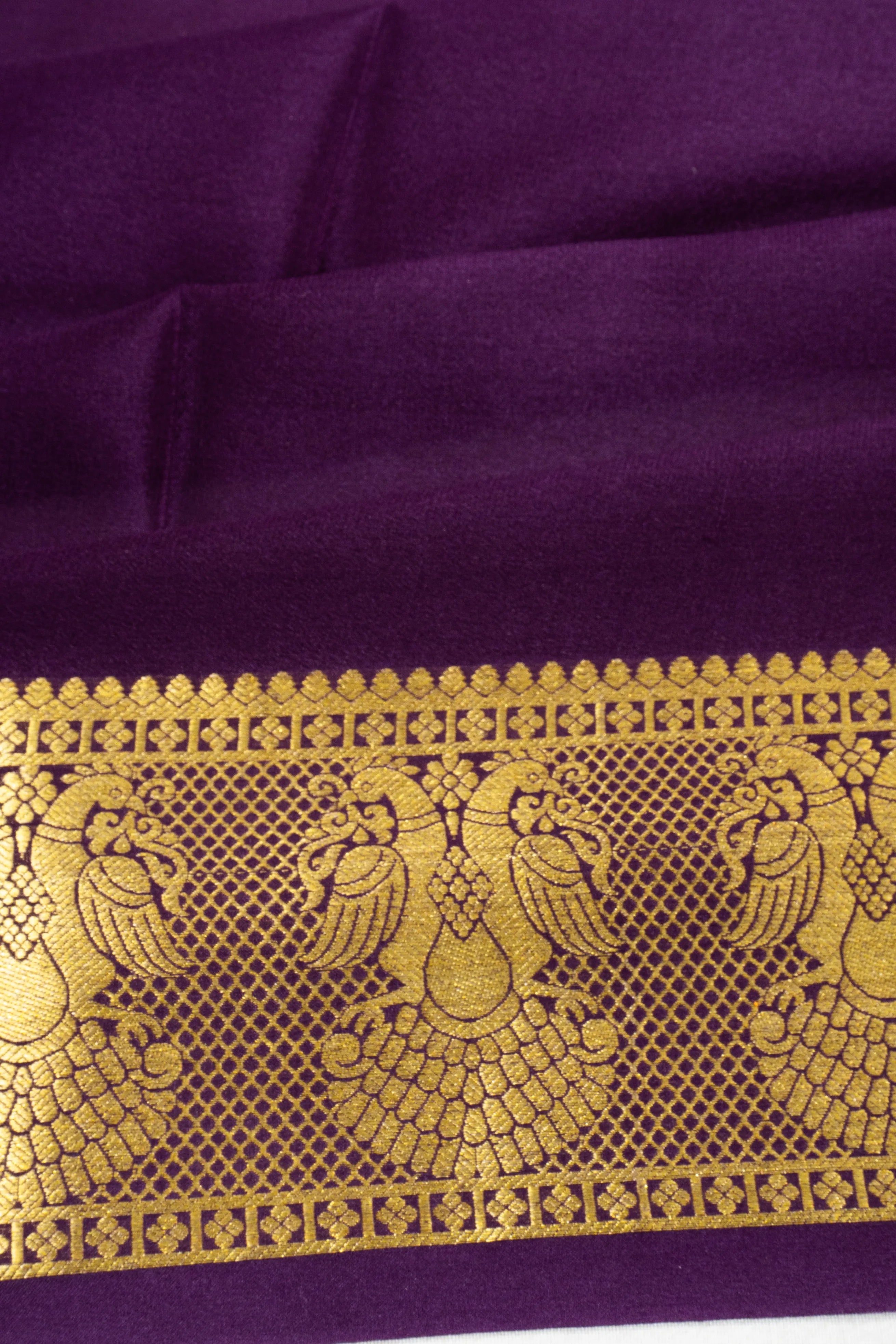 Binny Silk Plain Violet Saree With Gandabherunda Border