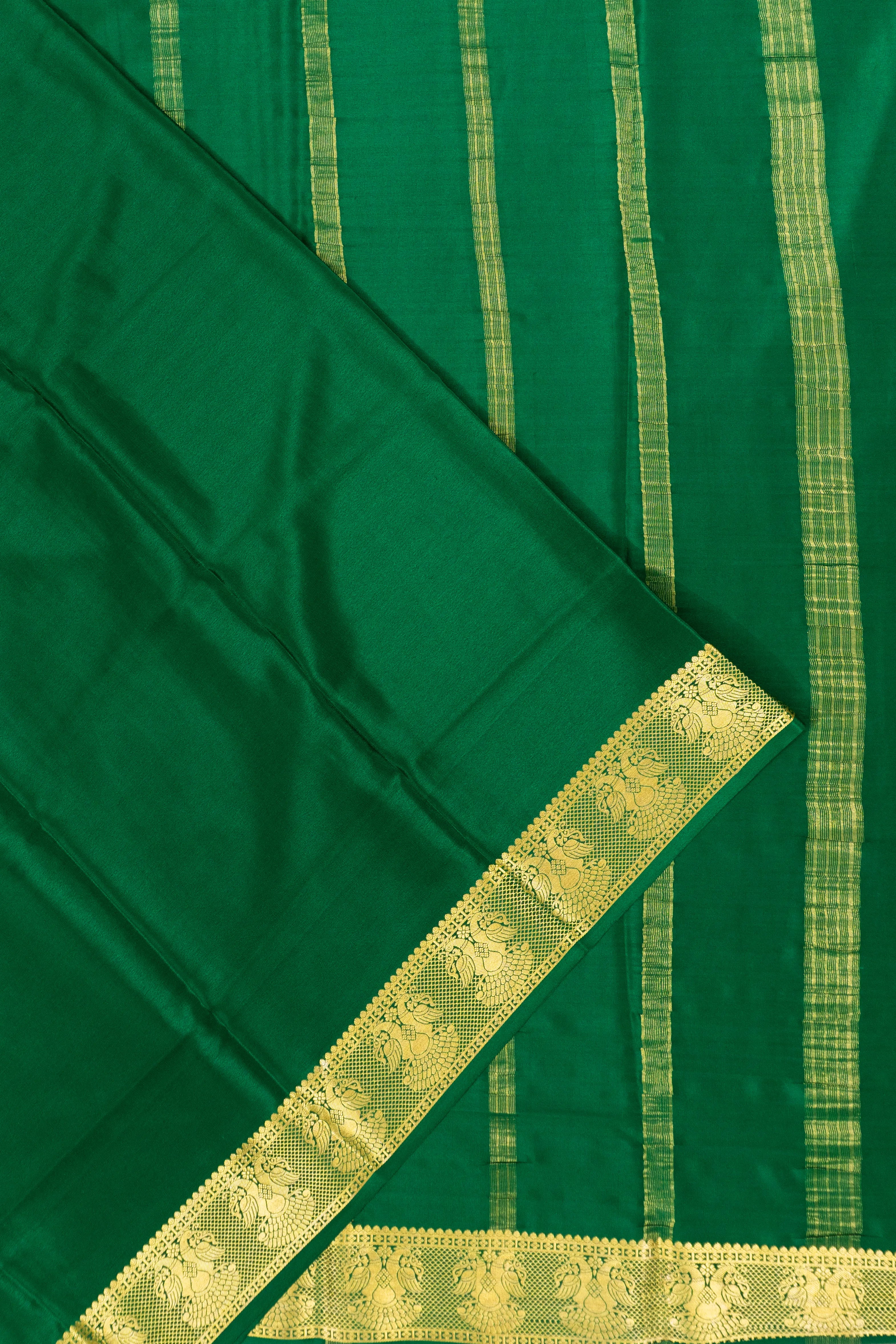 Binny Silk Plain Green Saree With Gandabherunda Border