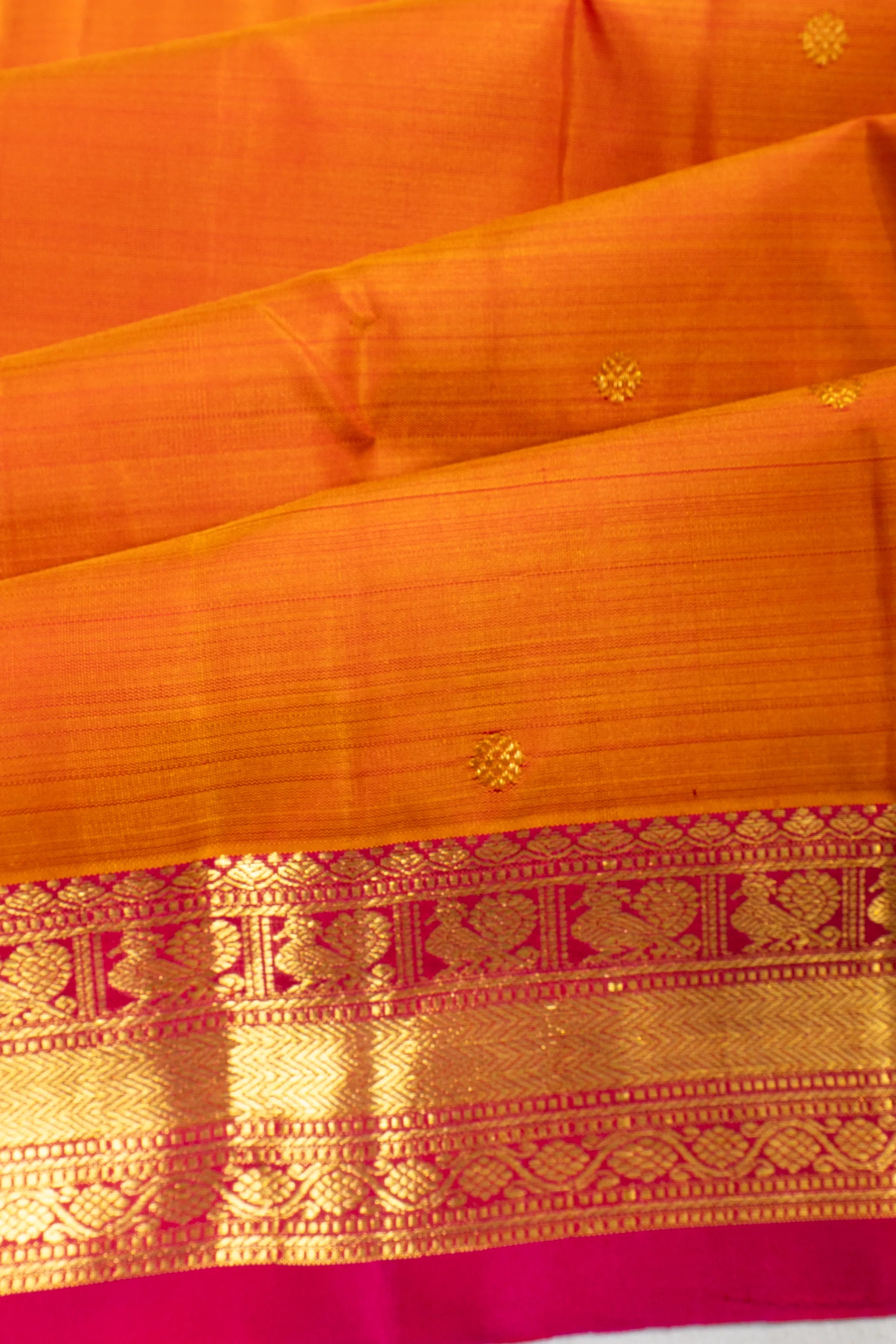 Taranga Kanchi Silk Butta Orange Saree