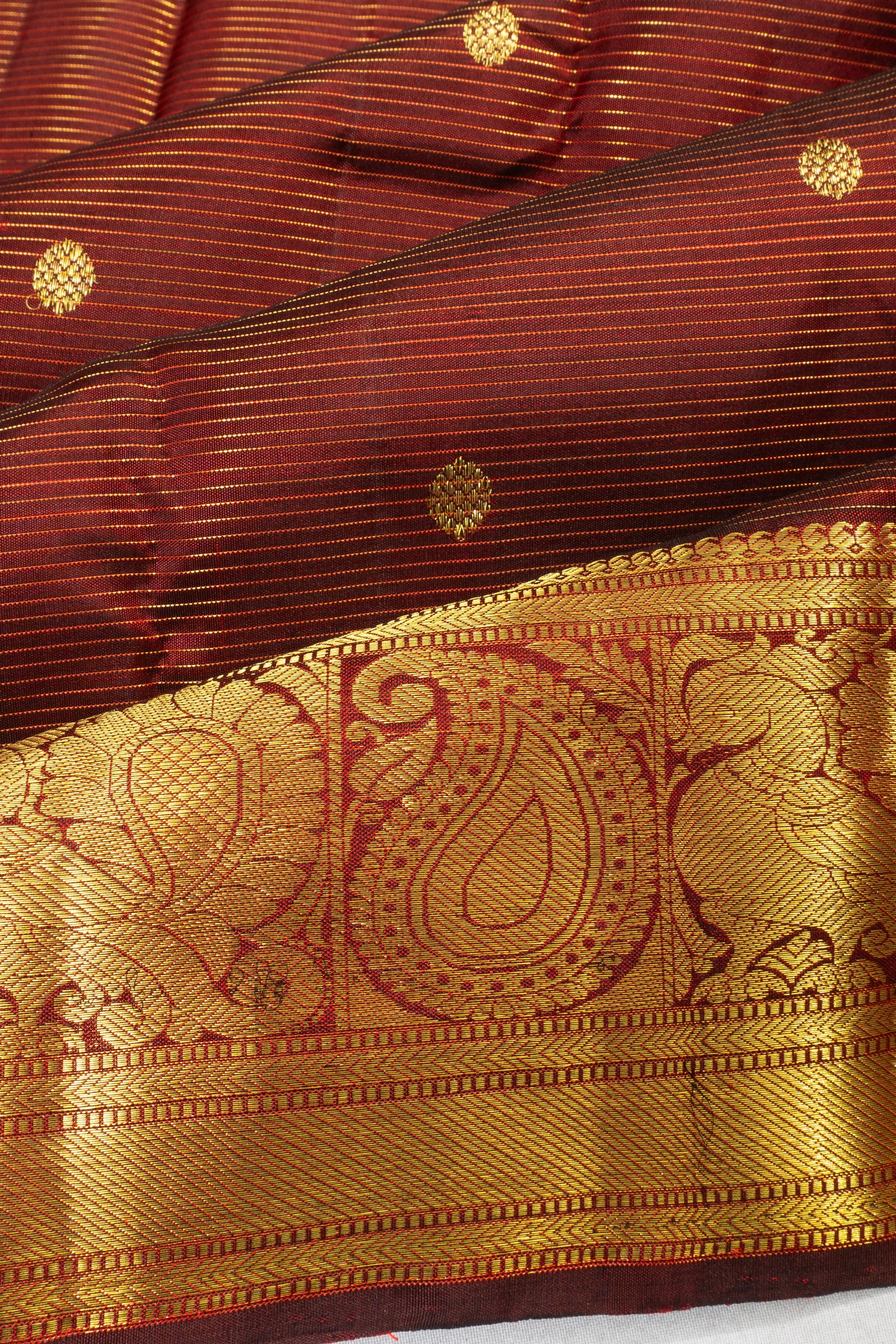 Taranga Kanchi Silk Oosi Lines And Butta Maroon Saree