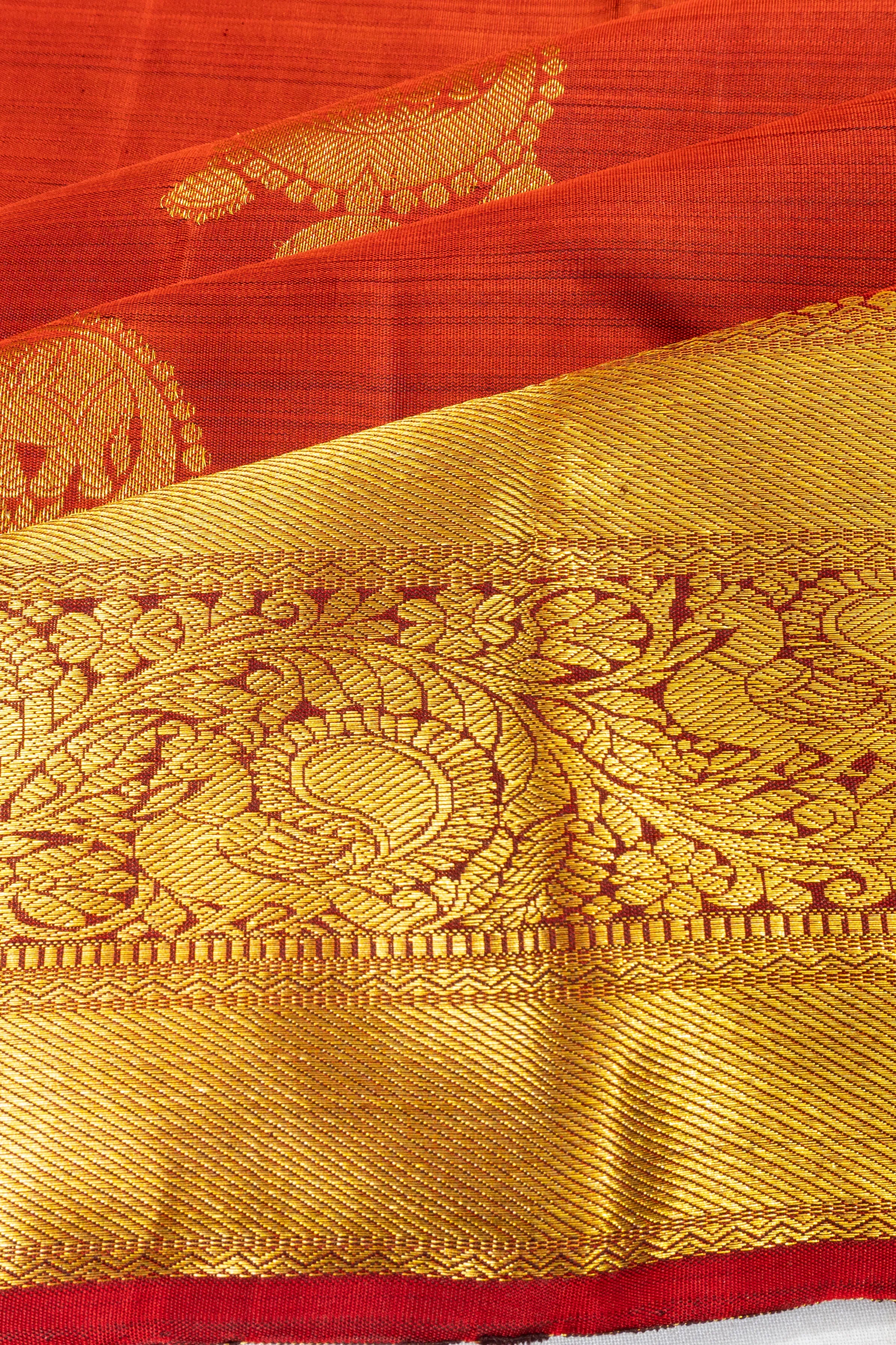 Taranga Kanchi Silk Butta Rust Orange Saree