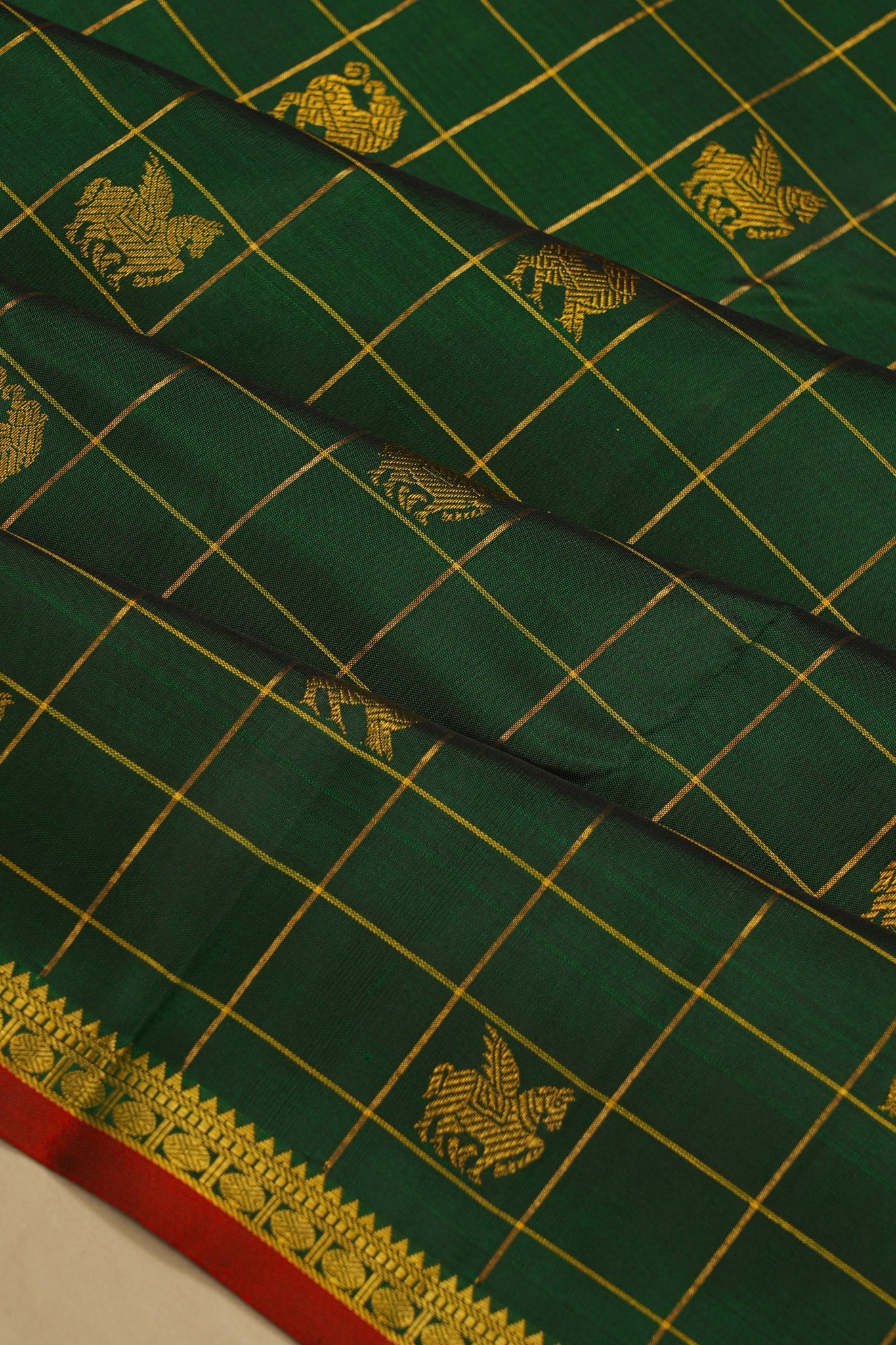 Kanchipuram Silk Checks And Butta Bottle Green Saree