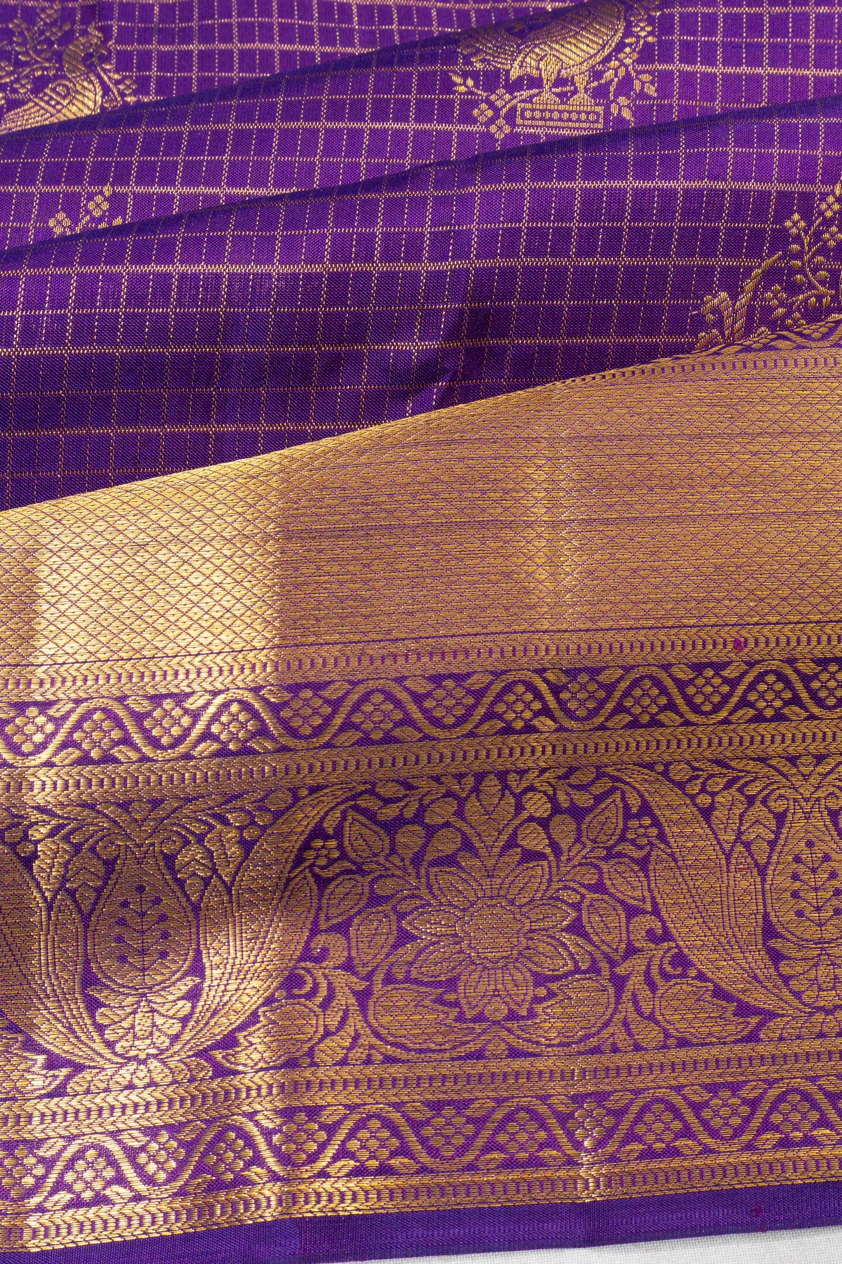 Taranga Kanchi Silk Checks And Butta Purple Saree