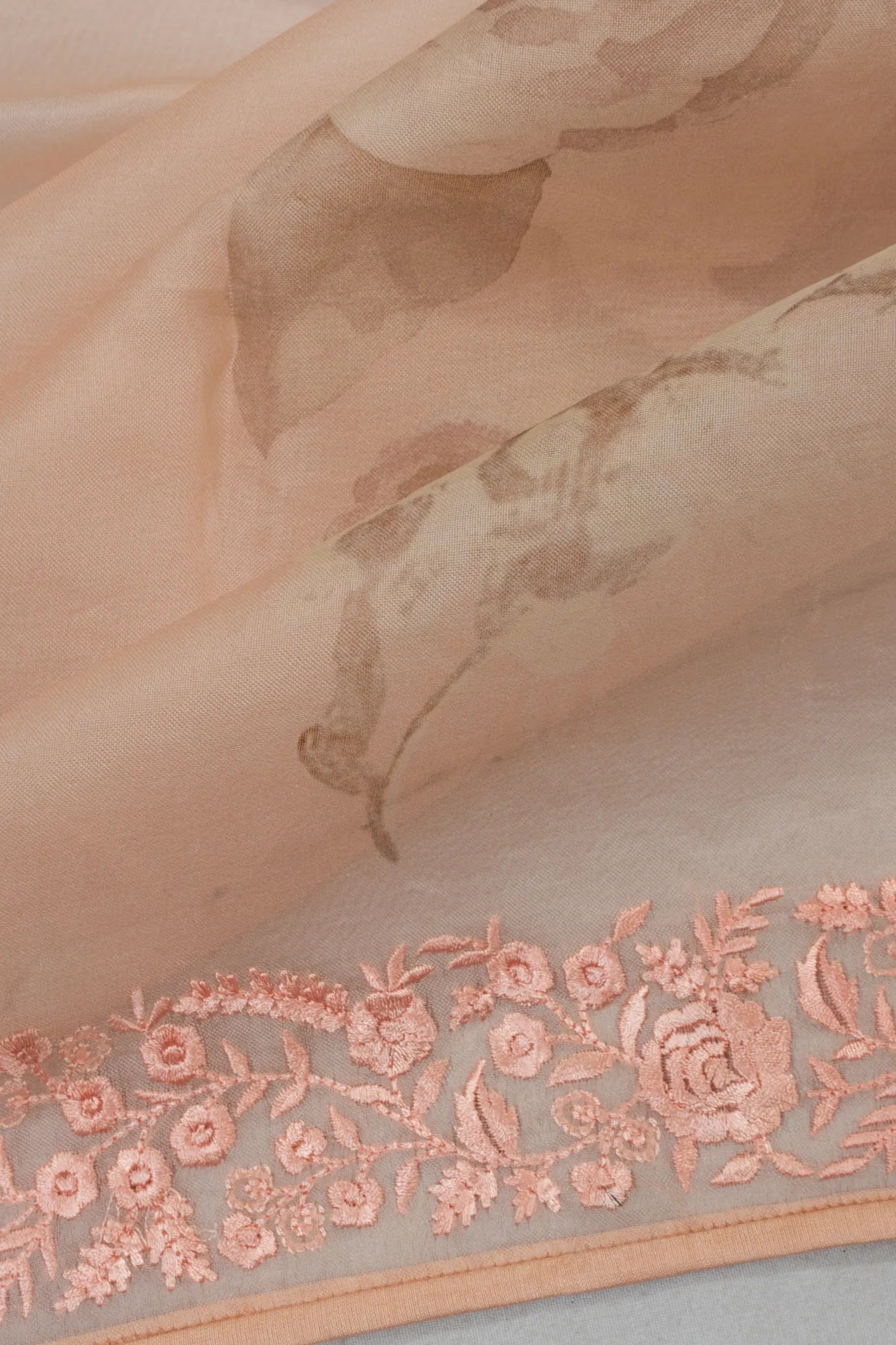 Organza Printed Pastel Orange Saree With Embroidery Border