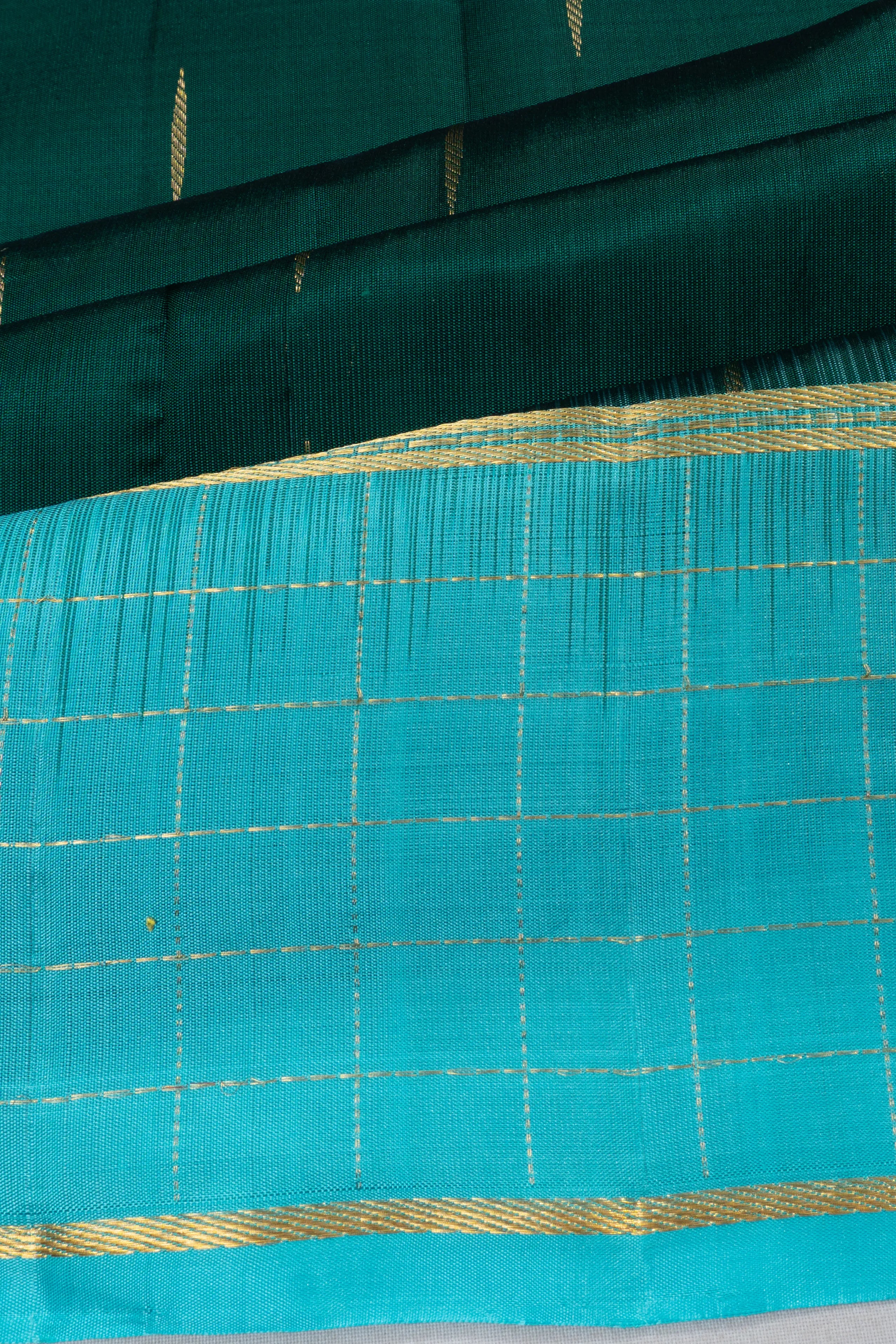 Taranga Kanchi Silk Butta Bottle Green Saree