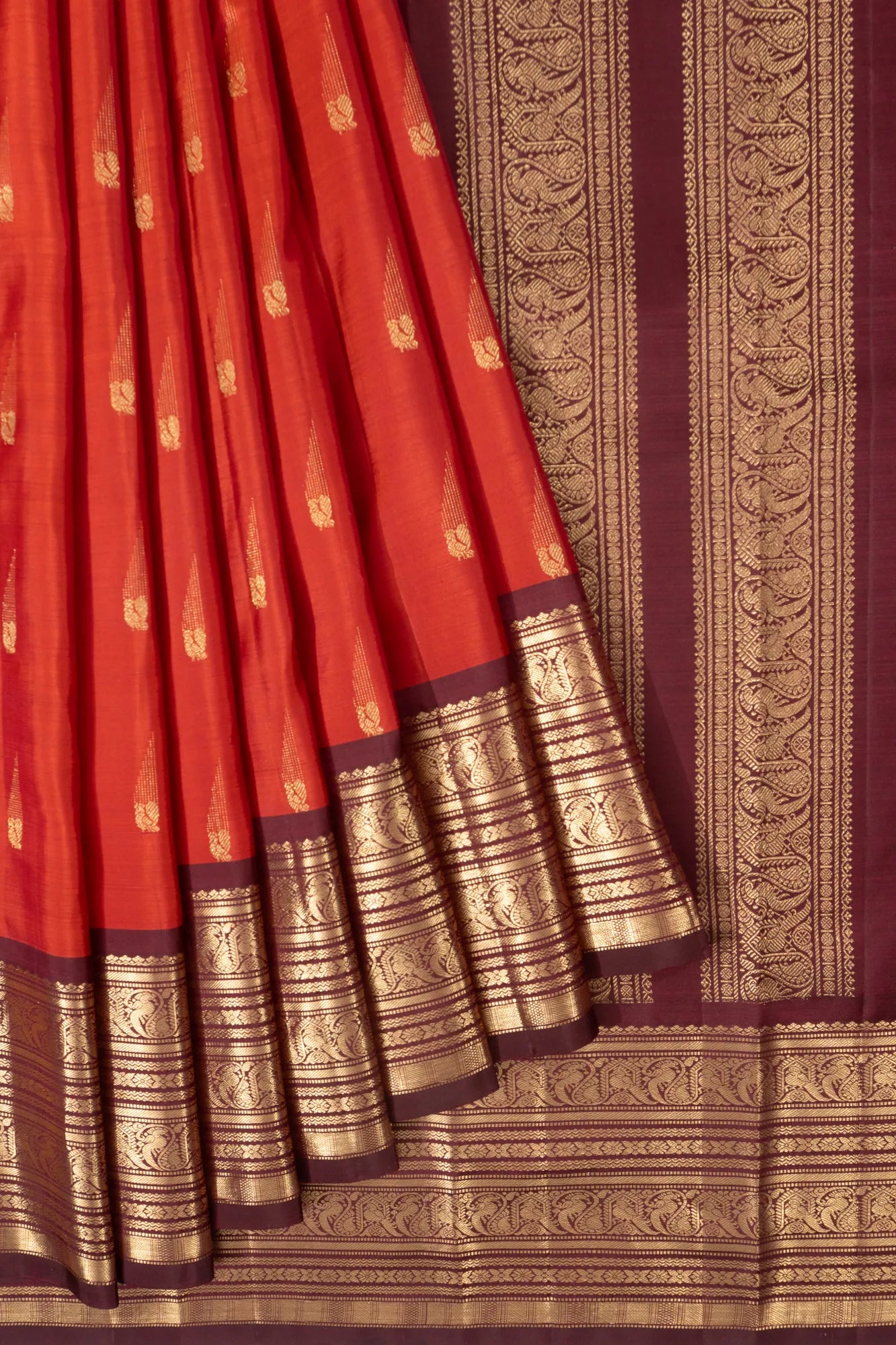 Taranga Kanchi Silk Butta Rust Orange Saree With Pichwai Motif Pallu