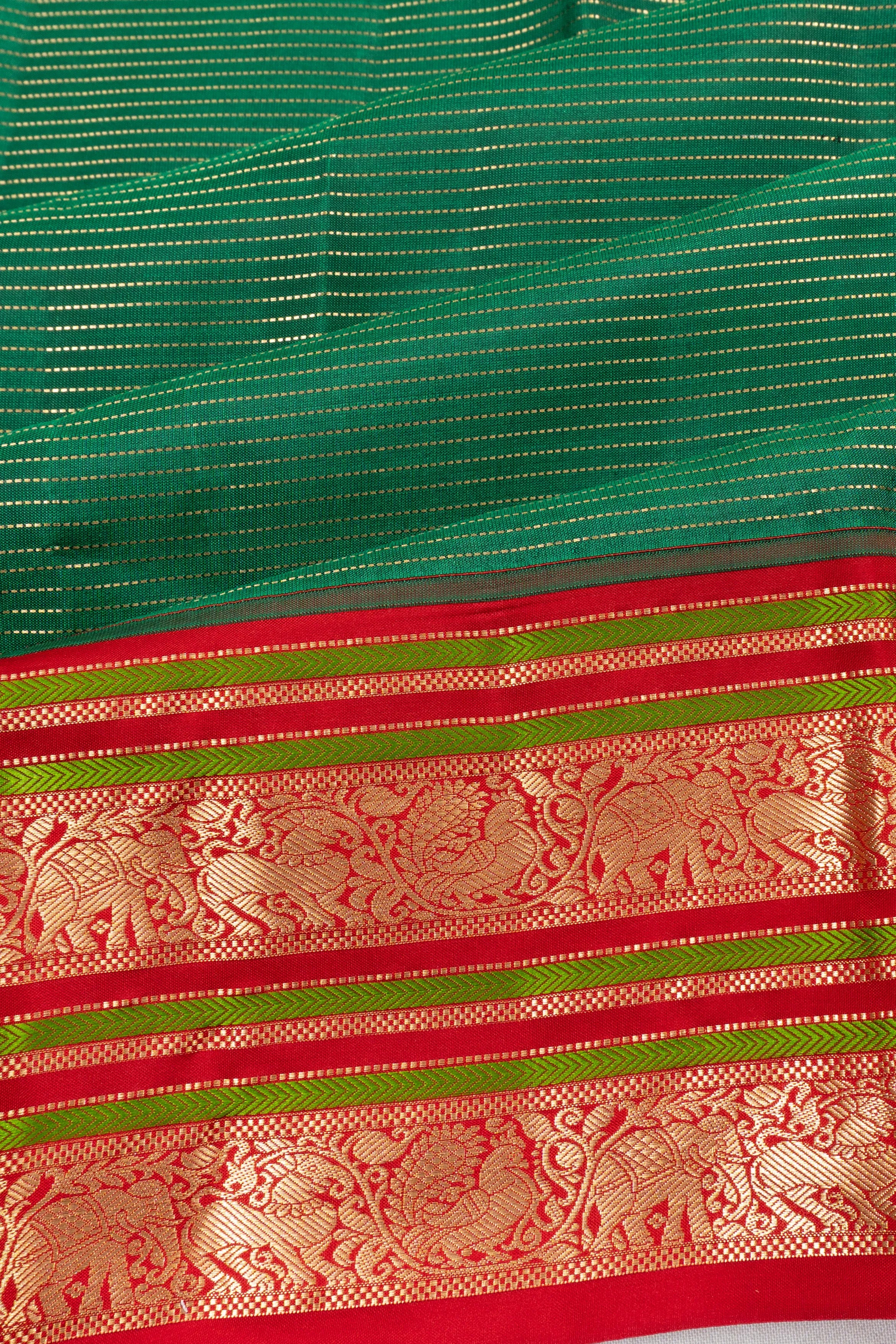 Taranga Kanchi Silk Oosi Lines Bottle Green Saree