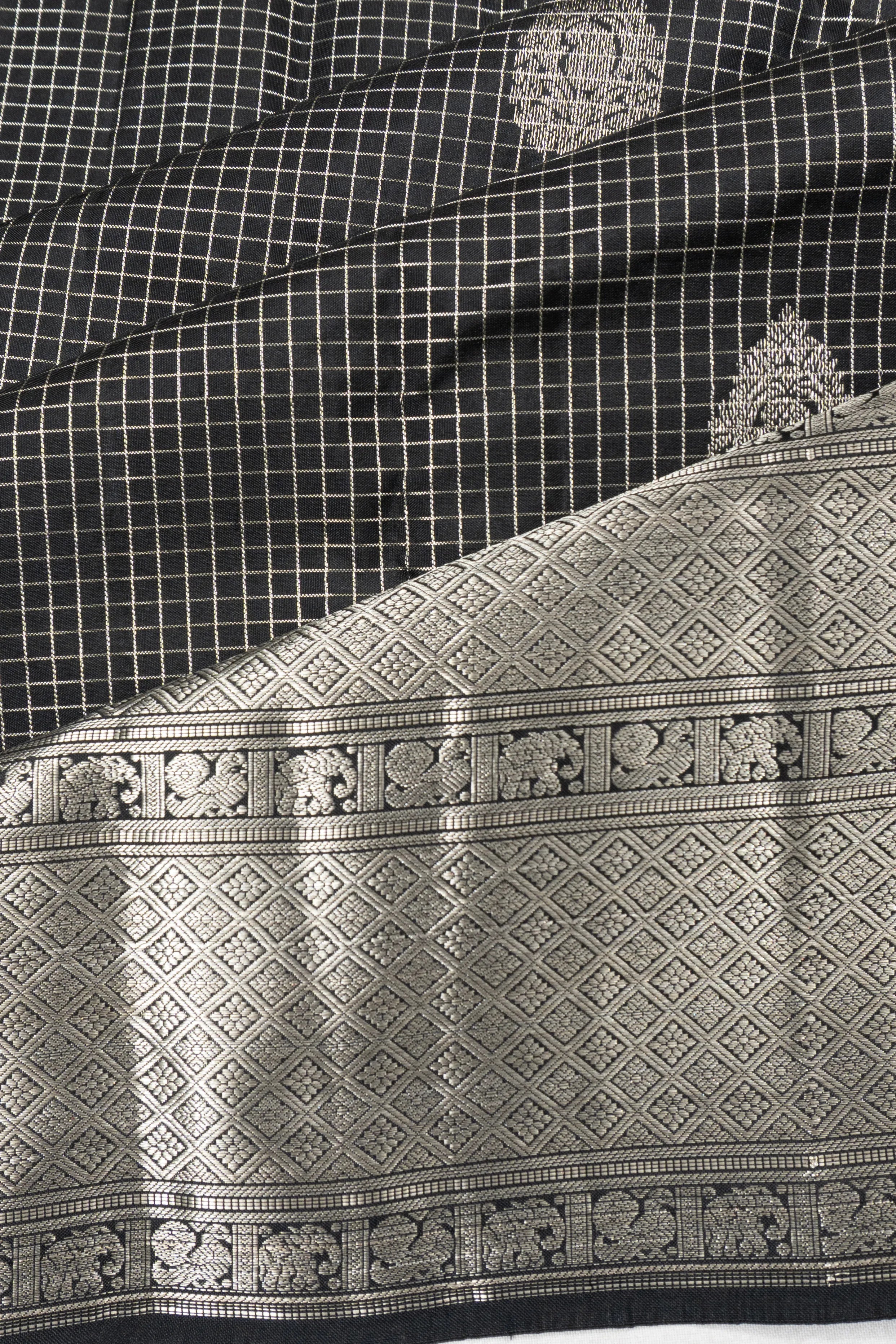 Taranga Kanchi Silk Checks And Butta Black Saree