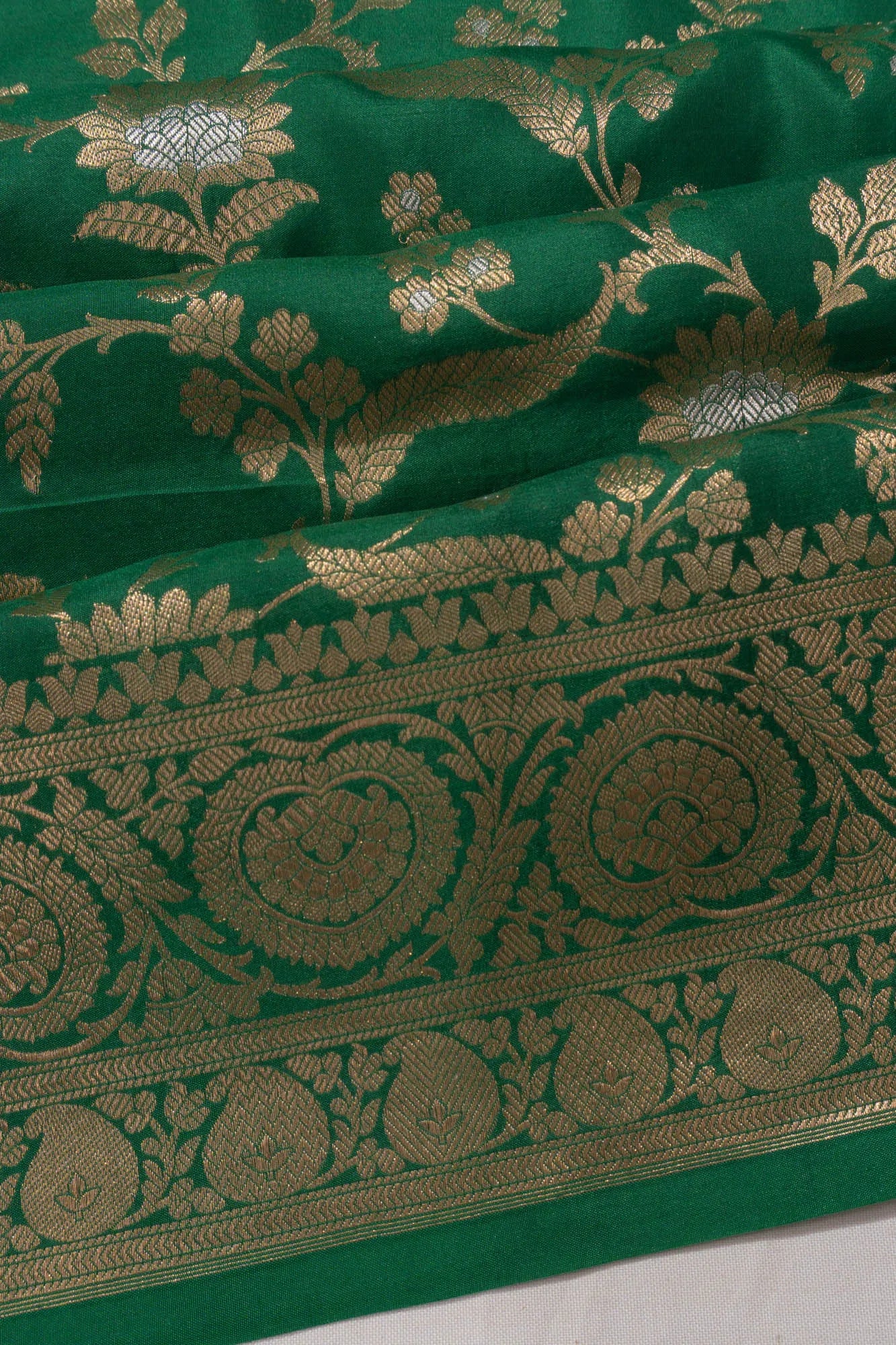 Vaanya Banaras Jaal Dark Green Saree