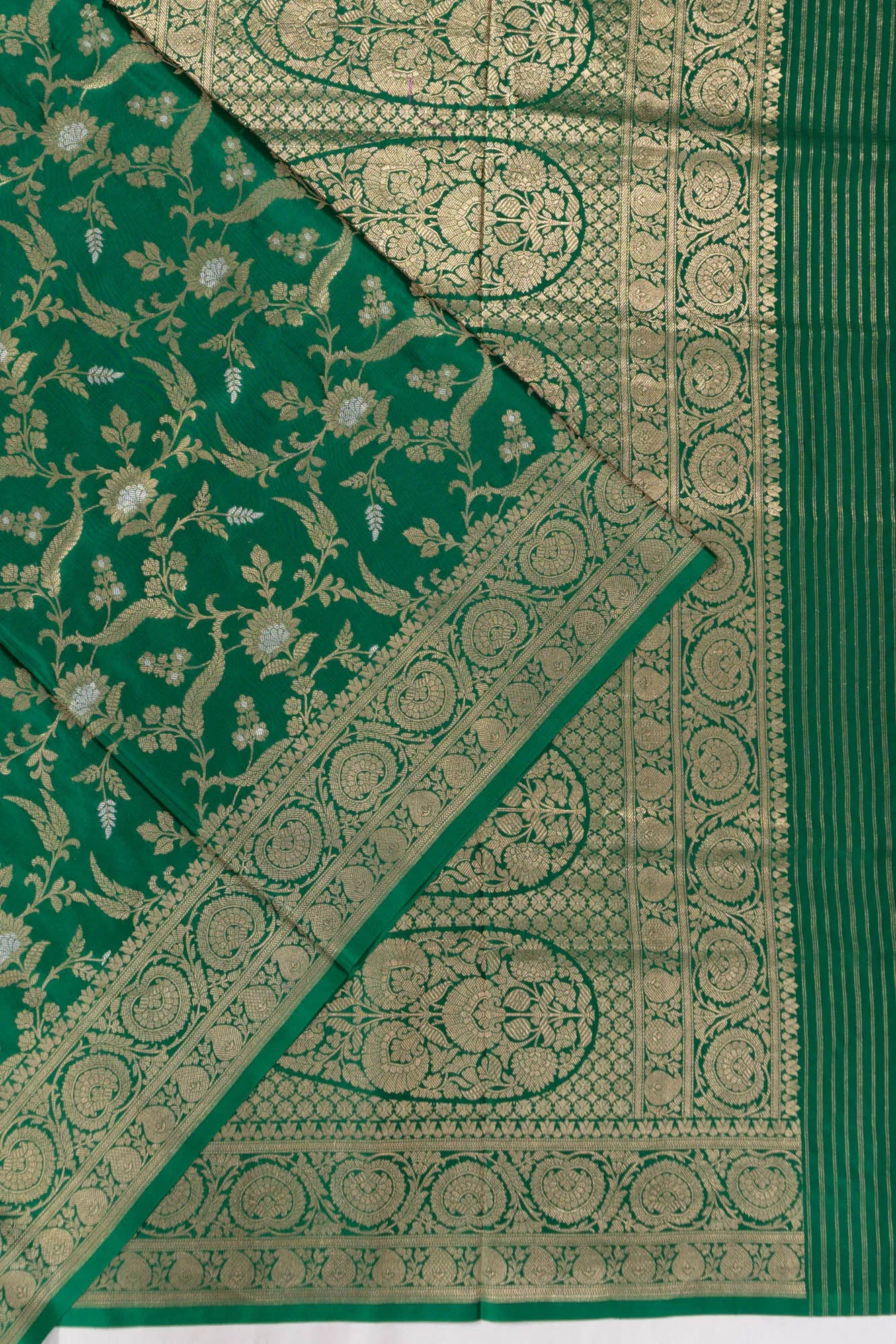 Vaanya Banaras Jaal Dark Green Saree
