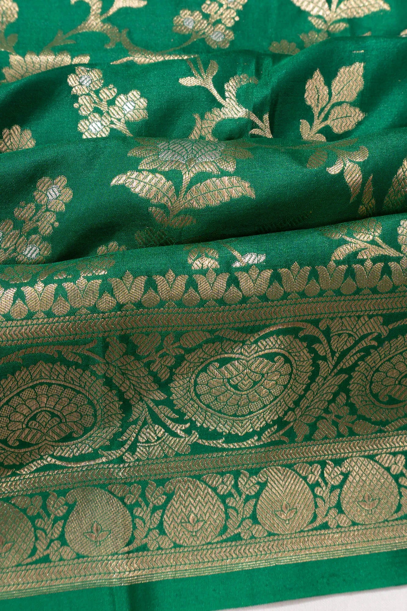 Vaanya Banaras Jaal Dark Green Saree