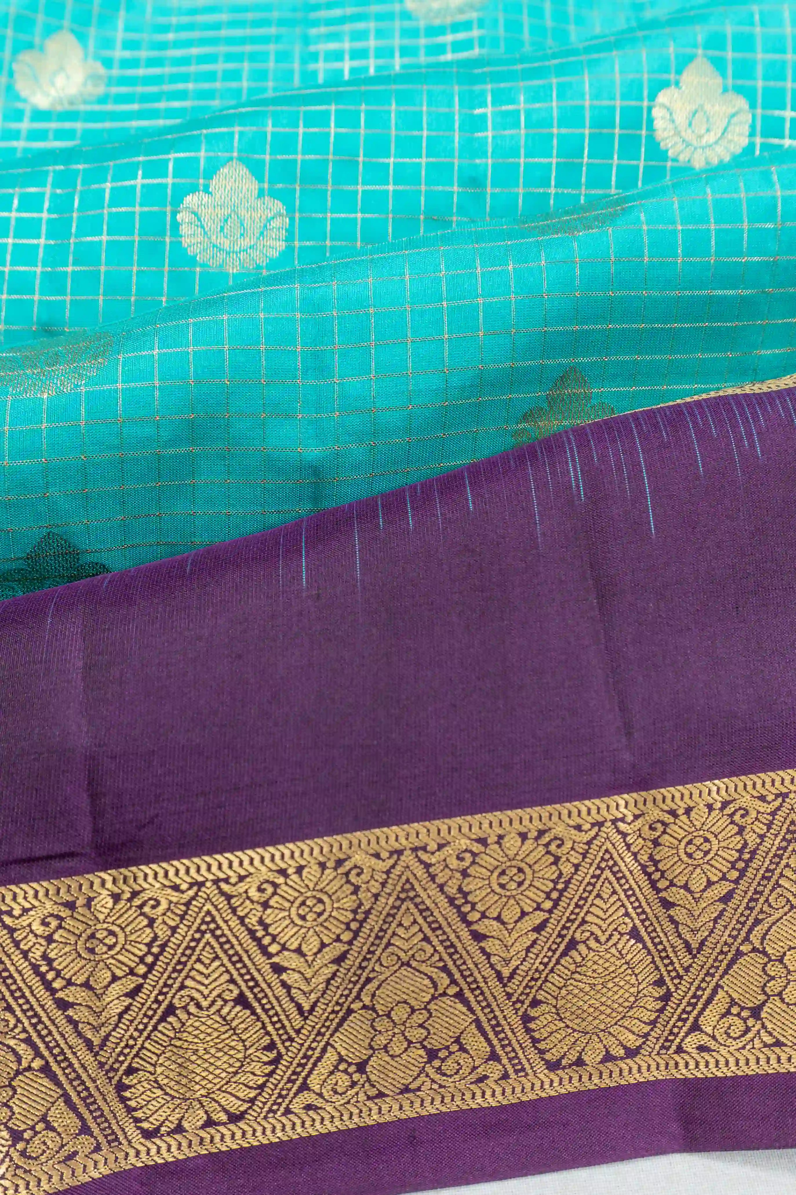 Taranga Kanchi Silk Checks And Butta Sky Blue Saree With Rettai Pettu Border
