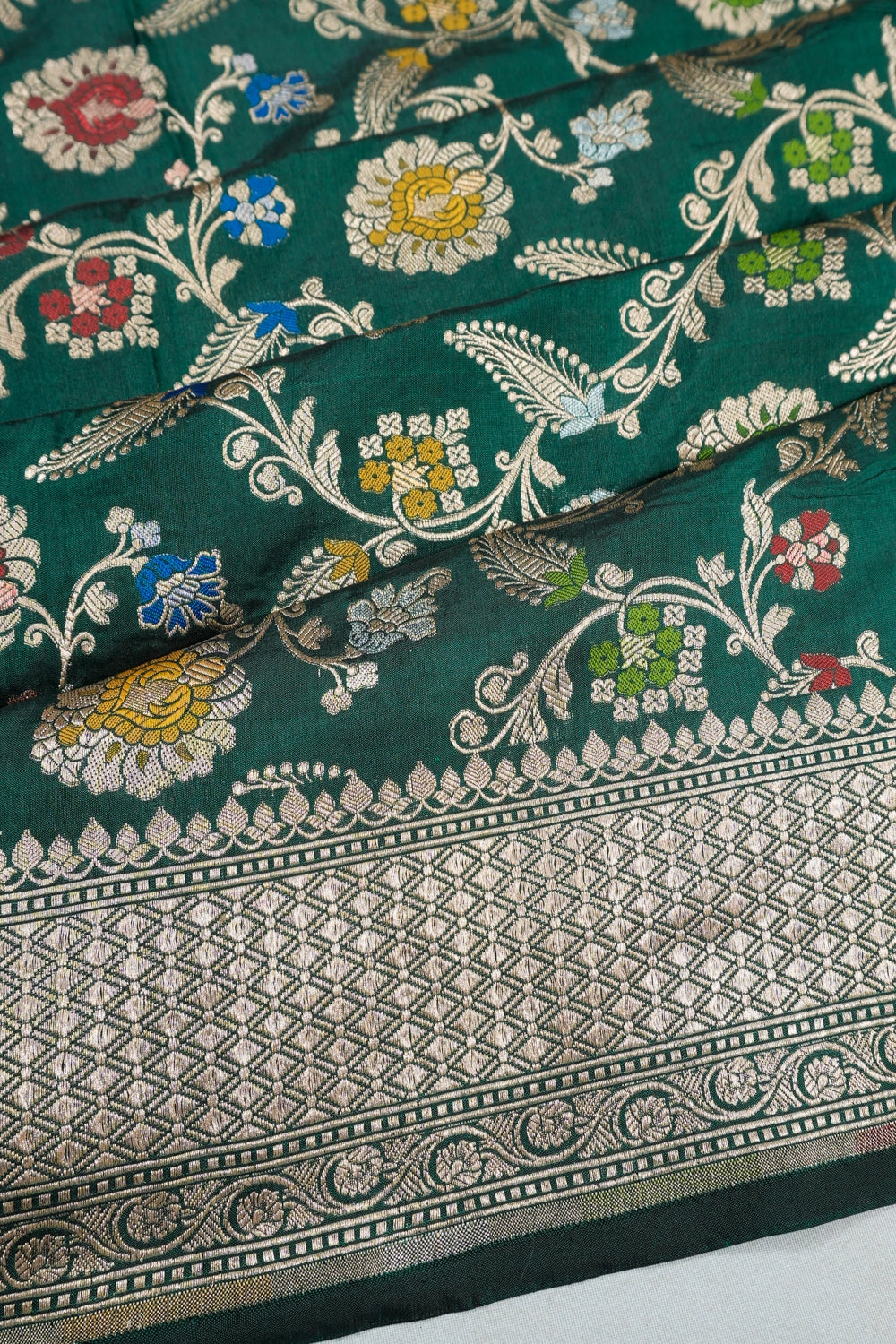 Vaanya Banaras Silk Jaal Bottle Green Saree