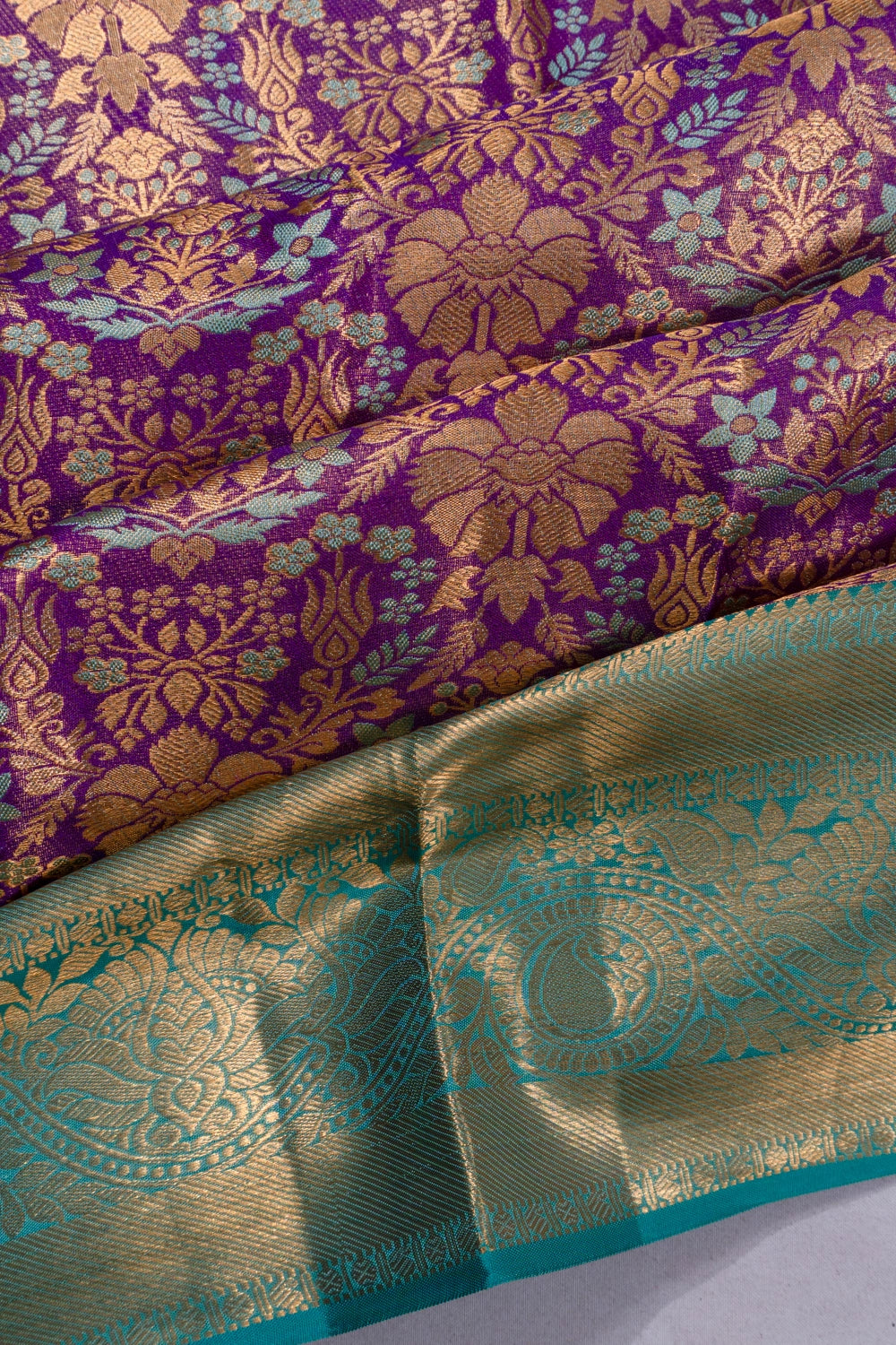 Taranga Kanchi Silk Tissue Jaal Purple Saree