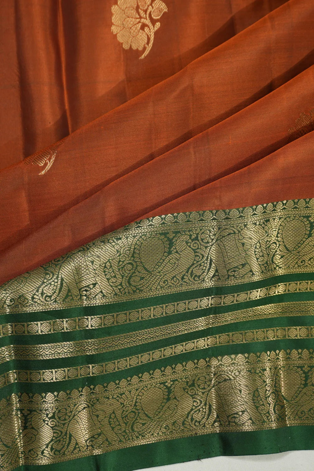 Taranga Kanchi Silk Butta Rust Orange Saree