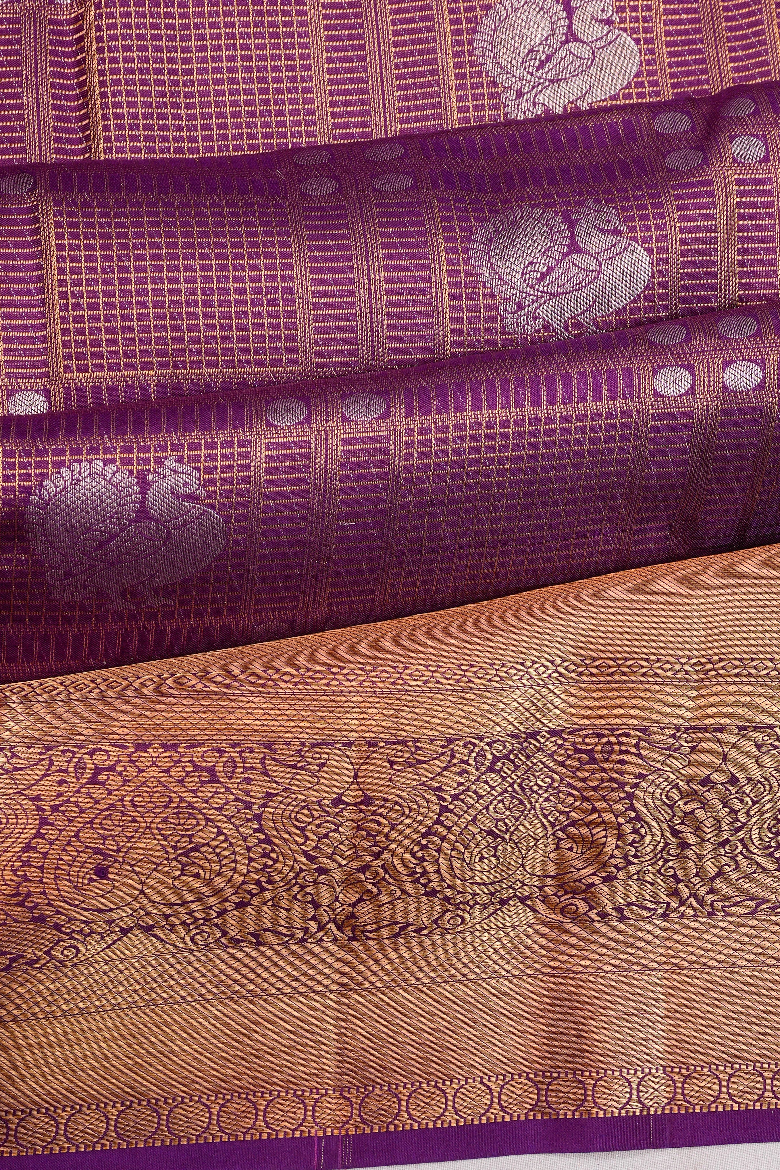 Taranga Kanchi Silk Checks And Butta Purple Saree
