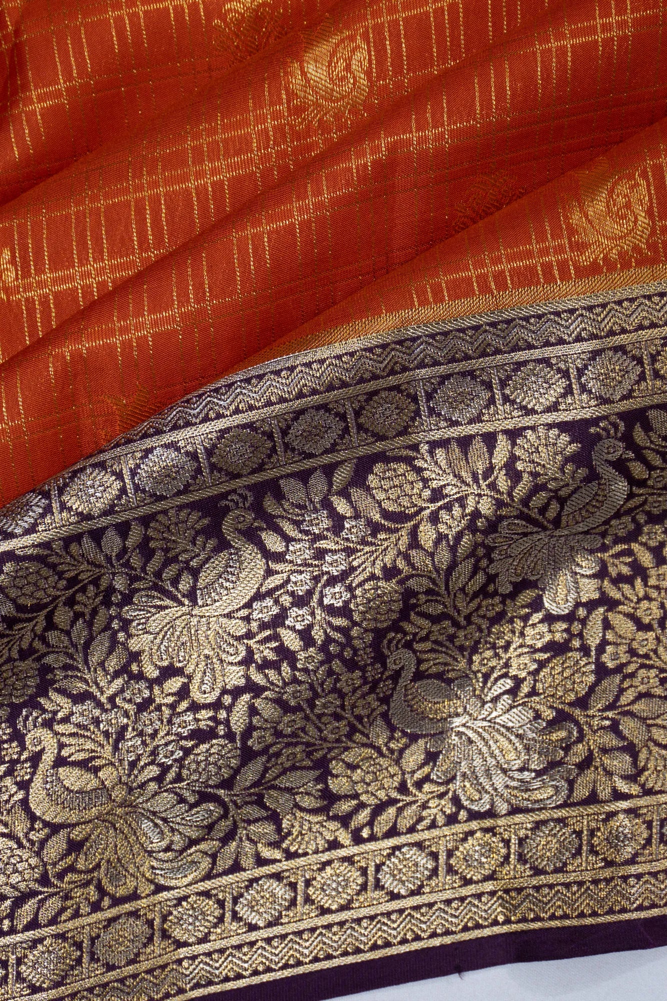 Taranga Kanchi Silk Checks And Butta Orange Saree