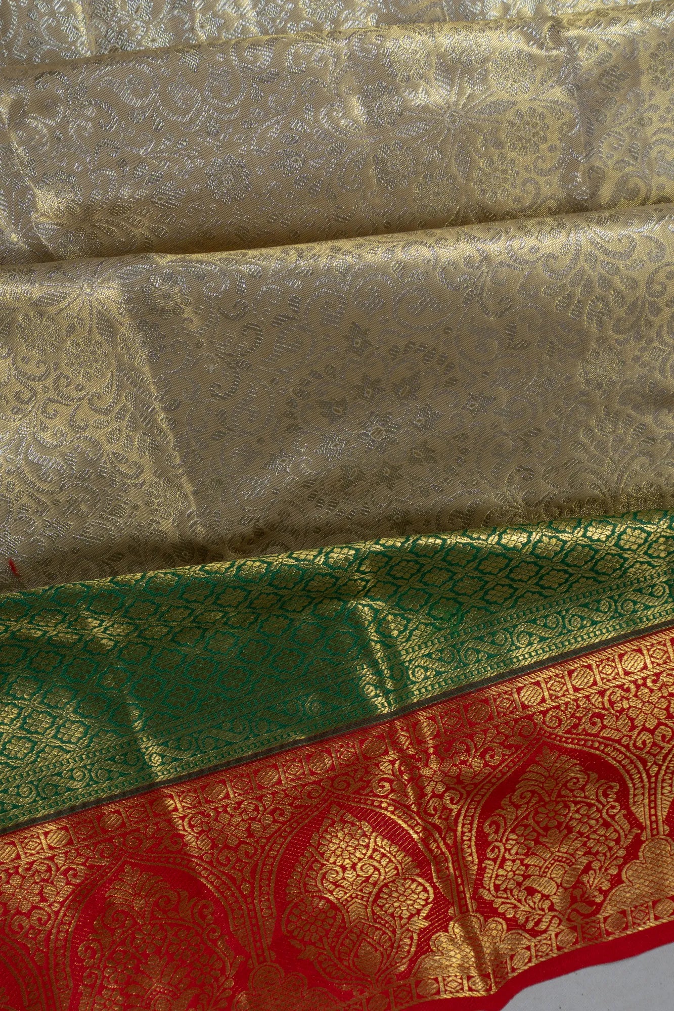 Taranga Kanchi Silk Tissue Brocade Gold Saree
