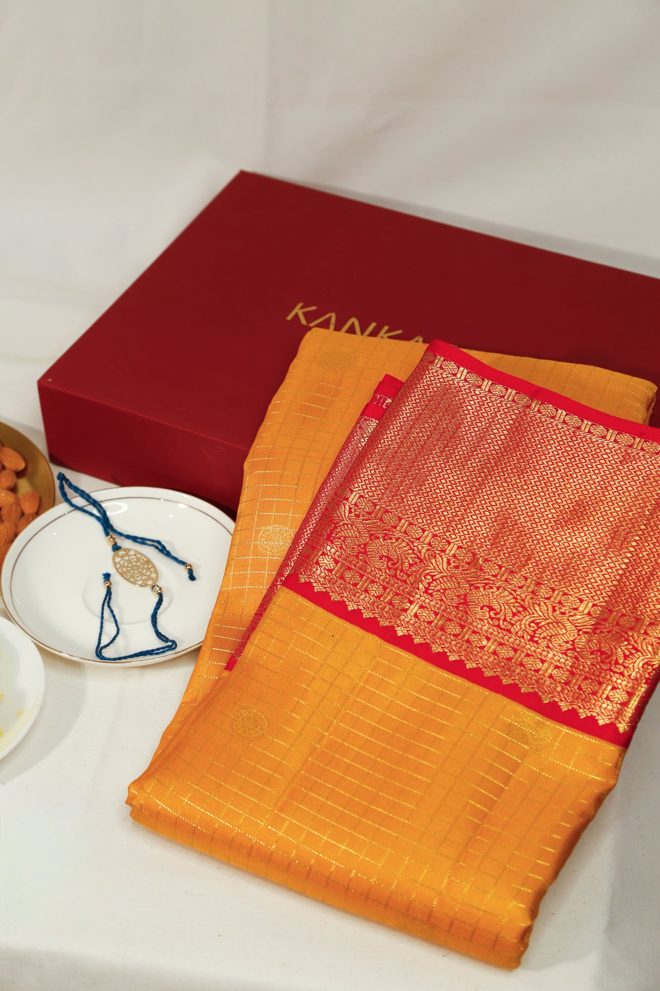 Taranga Kanchi Silk Checks Yellow Saree With Gift Box And Rakhi