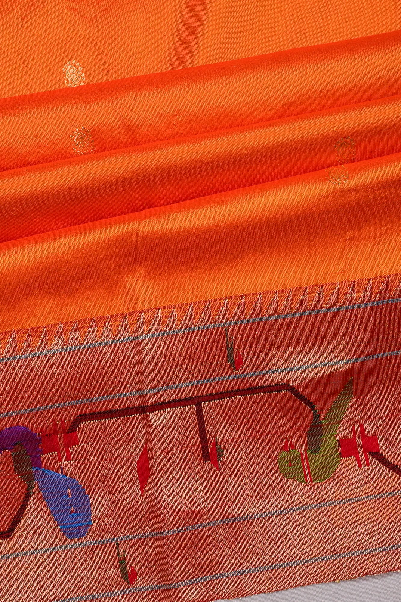 Paithani Silk Butta Orange Saree With Akruthi Border